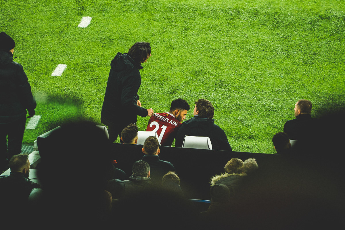 Alex Oxlaide-Chamblerlain getting some last minute instructions before coming on against Brighton
