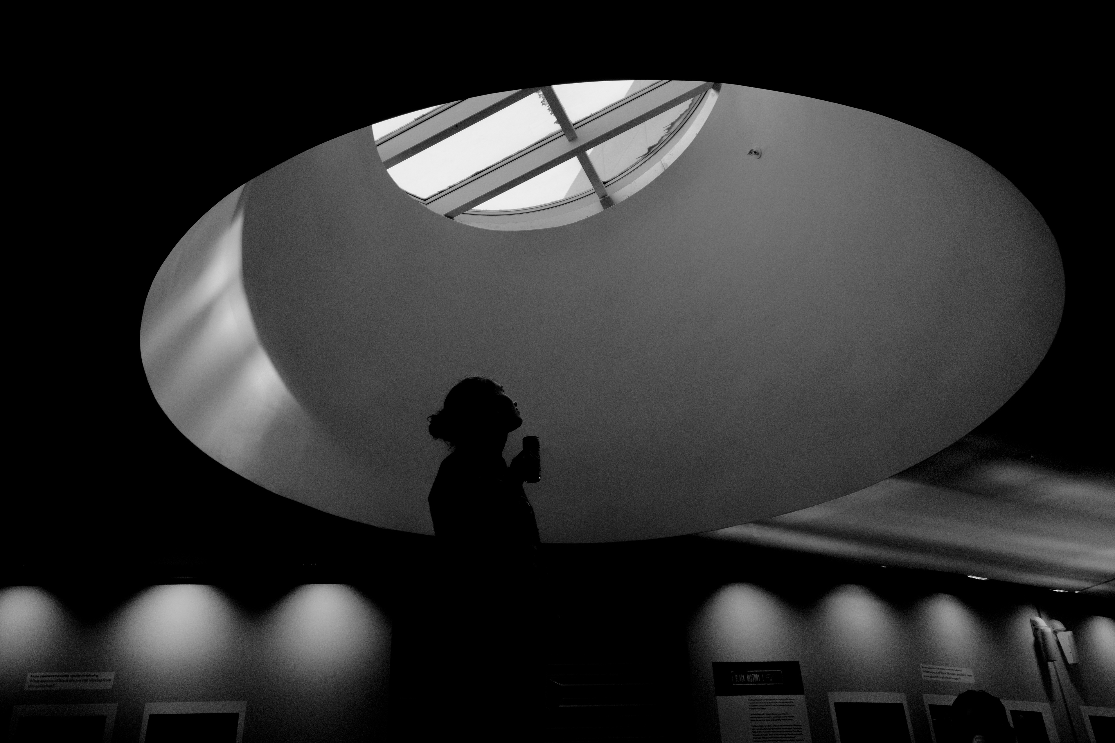 Television, radio and film sophomore Kaitlyn Kushner embraces natural light coming through a skylight in Food.com of the Newhouse 3 building during filming for a class assignment.