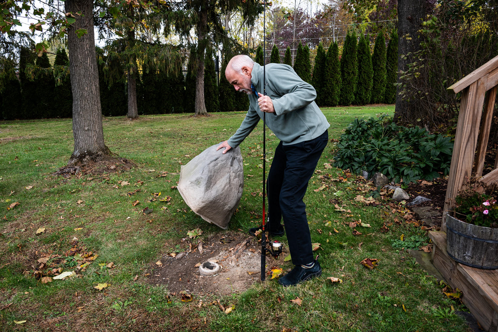 University Professor of Environmental Systems at Syracuse University and a long-time resident of Skaneatlas, NY, Dr. Charlie Driscoll checks his septic tank on Friday, Oct. 24, 2025, in Skaneatlas, NY. Driscoll’s property, which has one of the area’s oldest septic systems, was used by researchers studying groundwater and nutrient flow. 