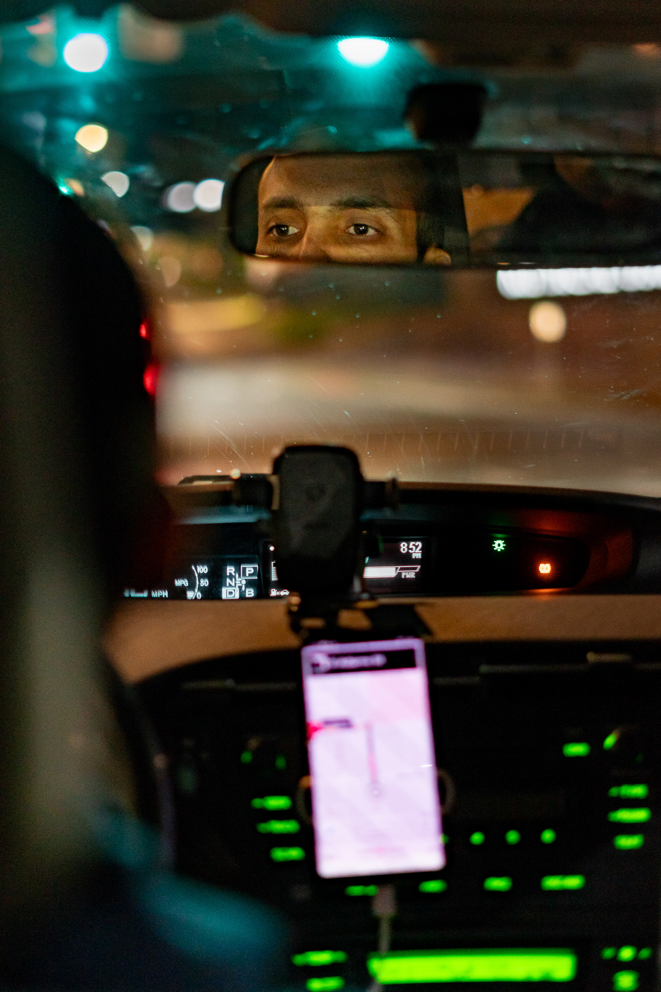 Salah-Eddeen drives passengers at night in Syracuse, NY. He is part of a community of workers who primarily labor after dark, providing essential services that are often overlooked.