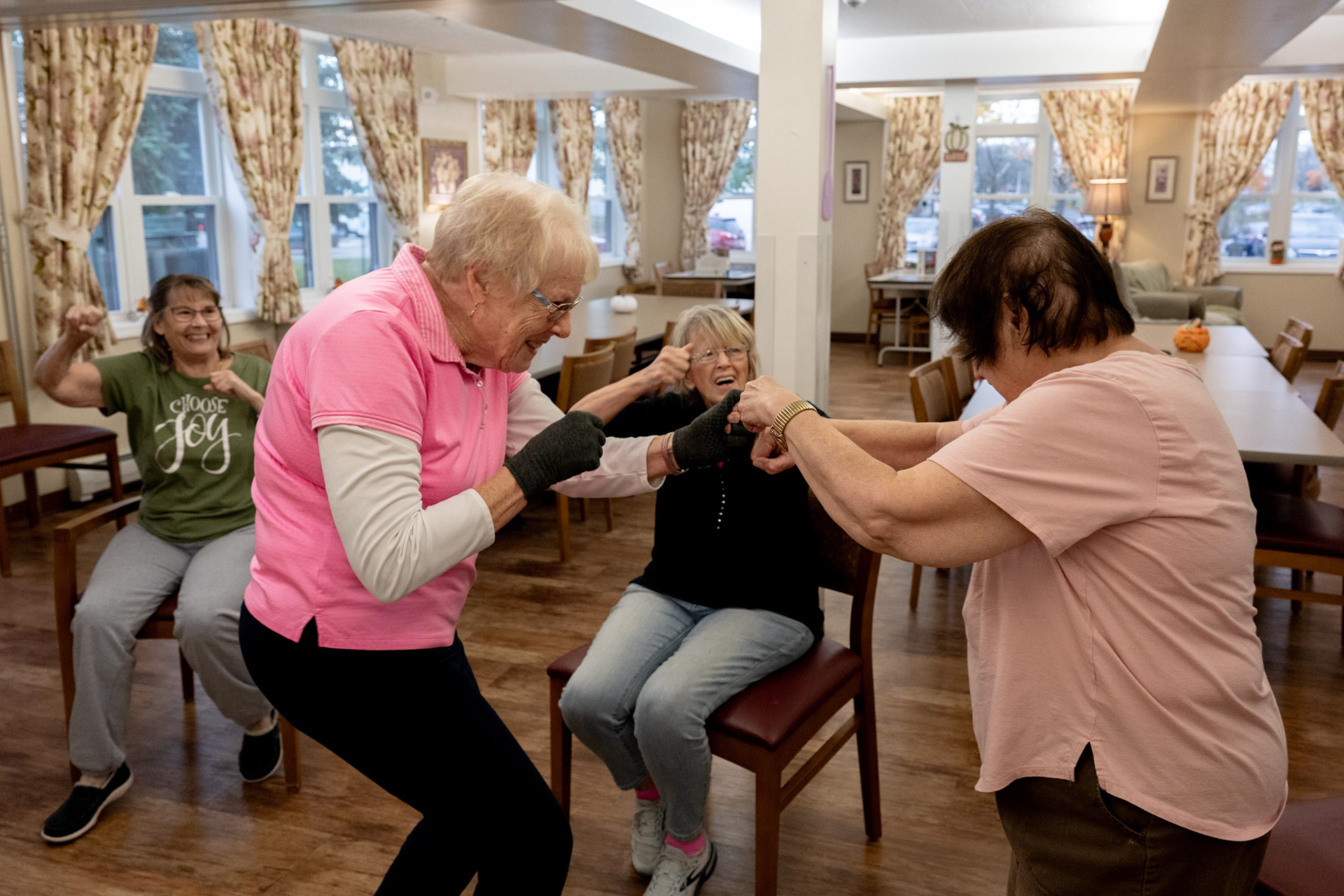 Cathy and Dawn practice punching exercises to improve their wrist mobility in Barb’s exercise class on Tuesday, Nov. 4, 2025, in Syracuse, N.Y.
