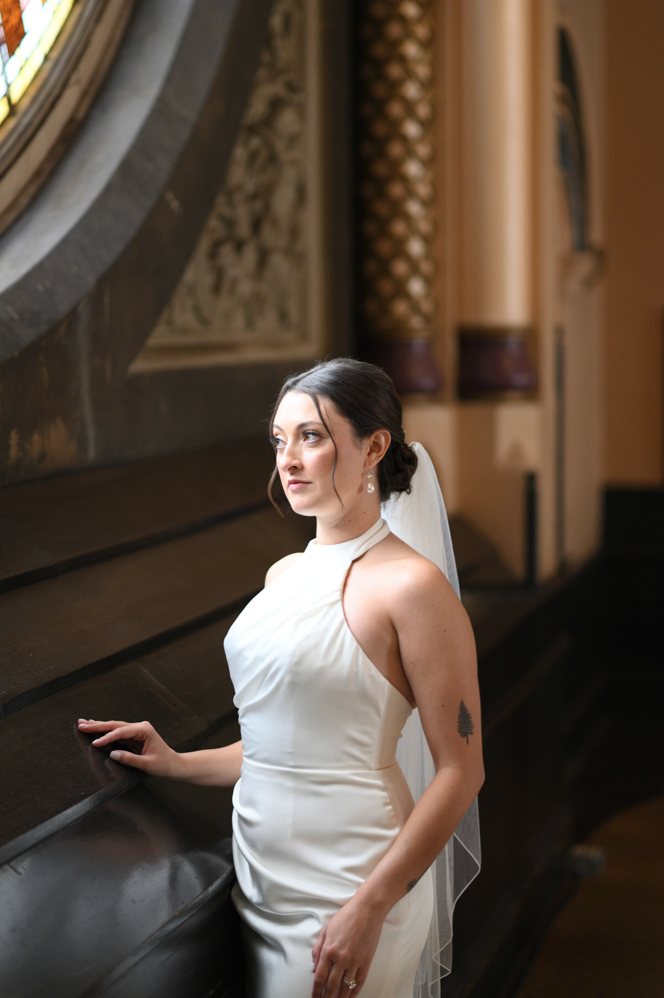 Bride staring out the window reflecting on her day