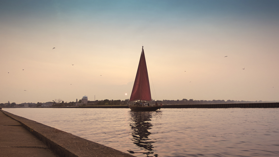 Red Witch II sailboat returning to dock in Kenosha Wisconsin. 