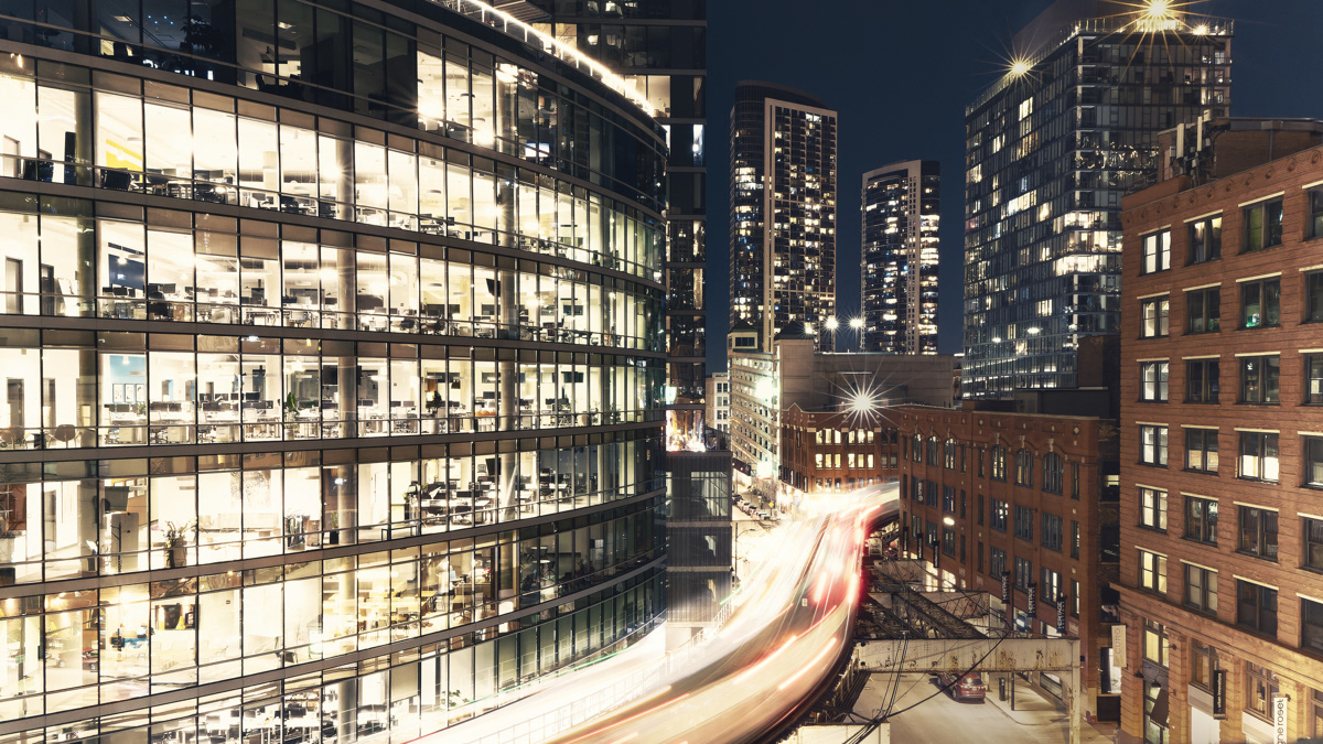 Light trails from trains passing Wells-Kinzie in Chicago at night.