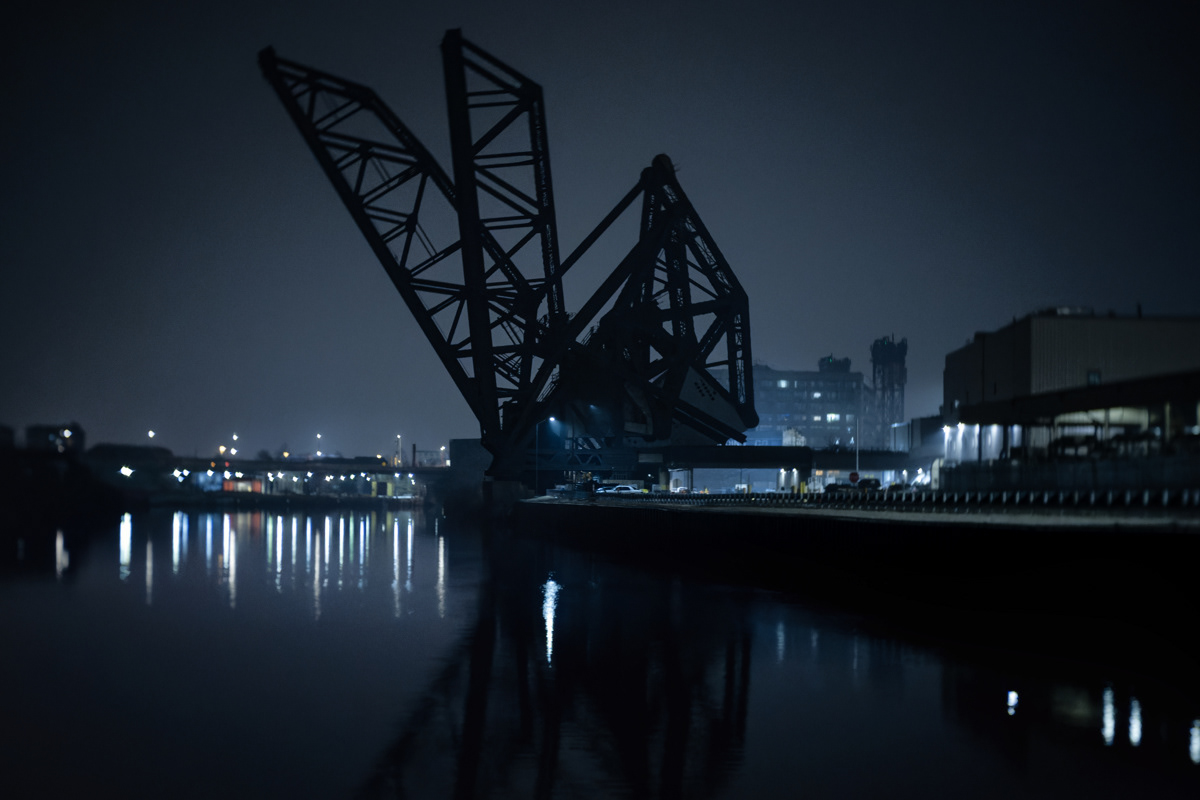 Slihouette of the St. Charles Airline bridge at night from the Chicago River.