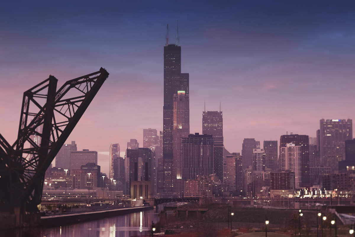 View of Chicago skyline with a bright pink sunset from the 18th Street Bridge.