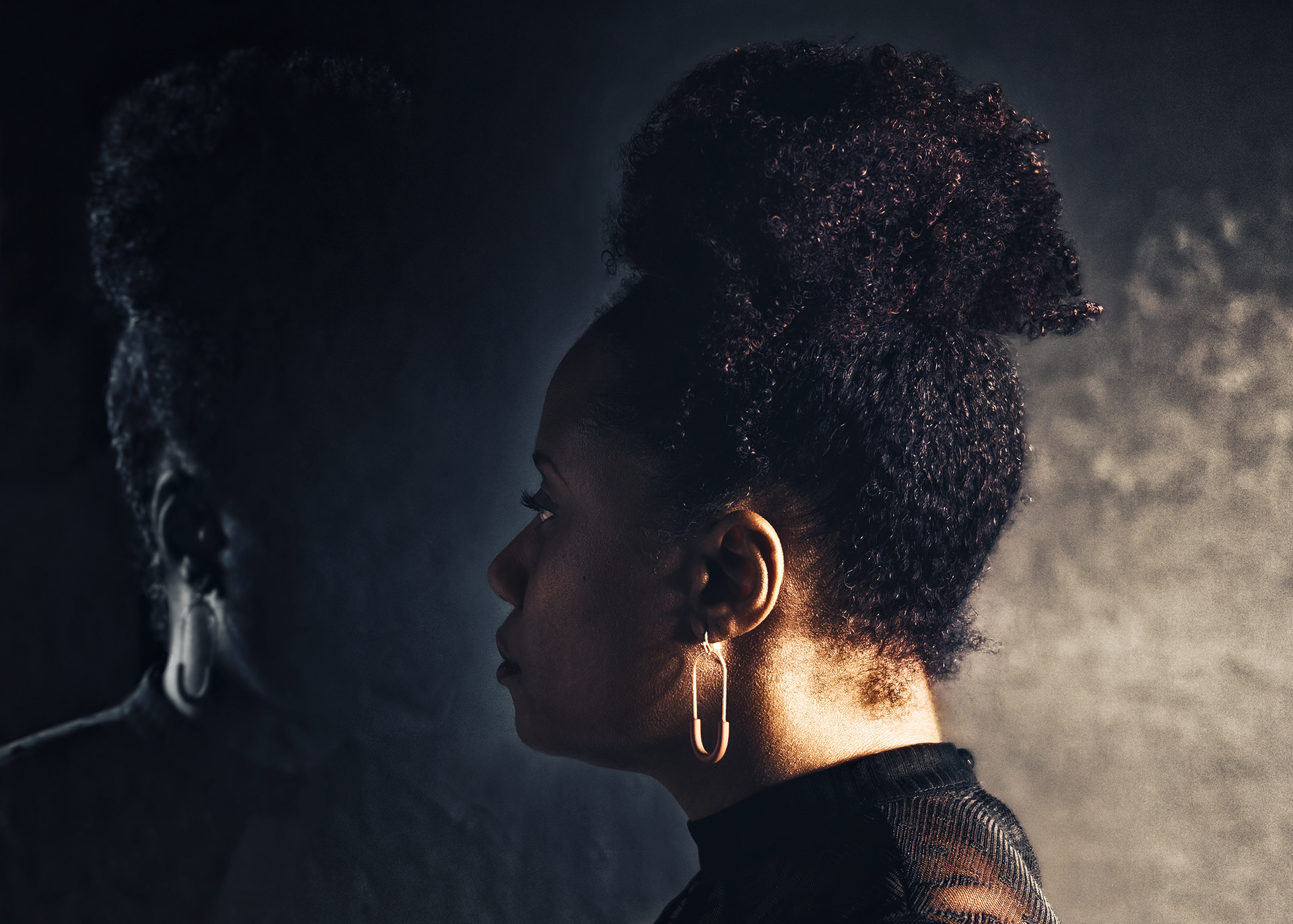 Self portrait of African American woman staring at her empty reflection