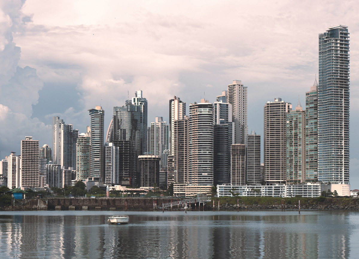 Fine art photo of Panama City skyline with one small boat in front