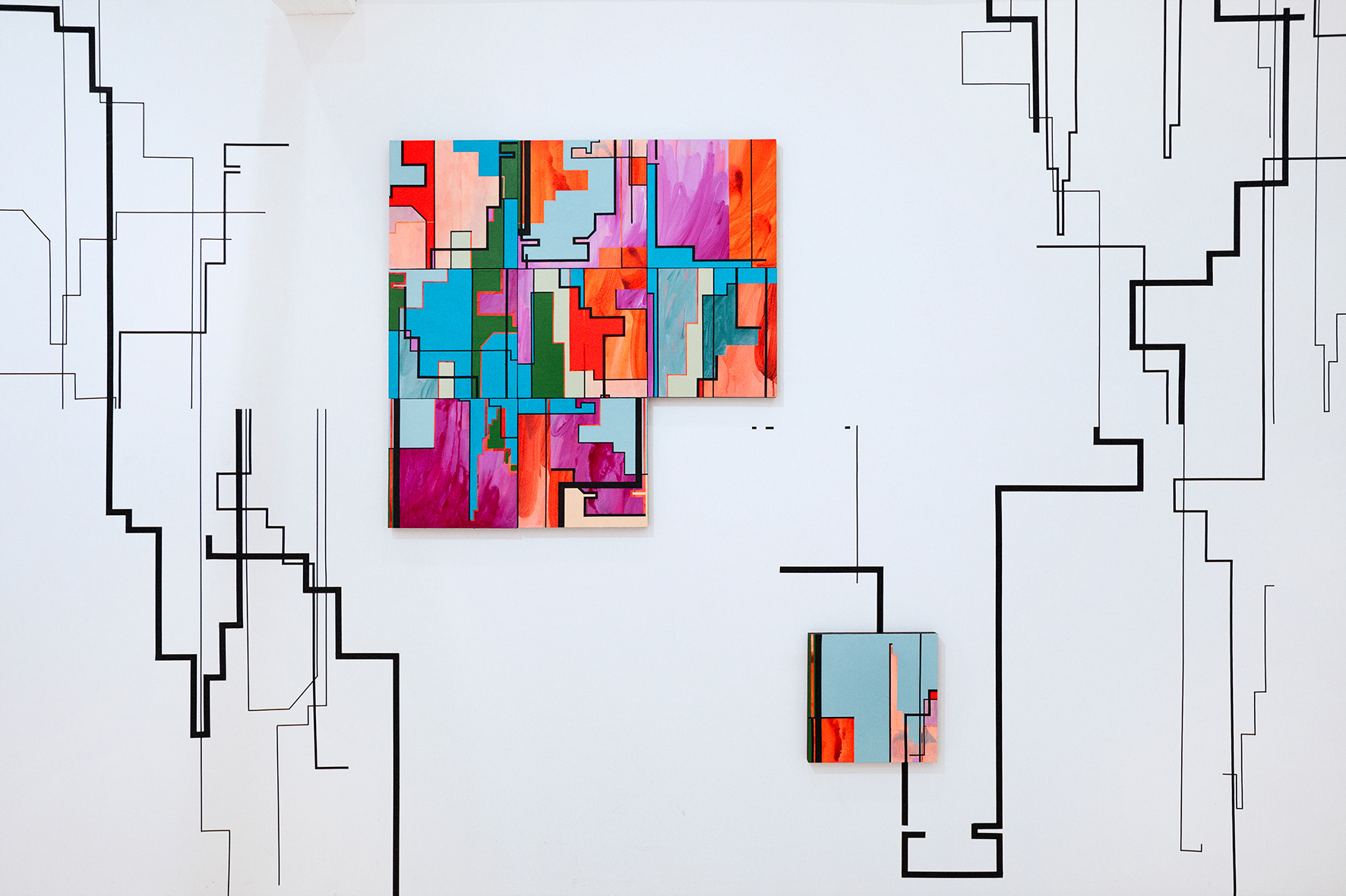 abstact cityscape wall drawing with washi tape and colourful abstracted cityscape painting by merryn trevethan