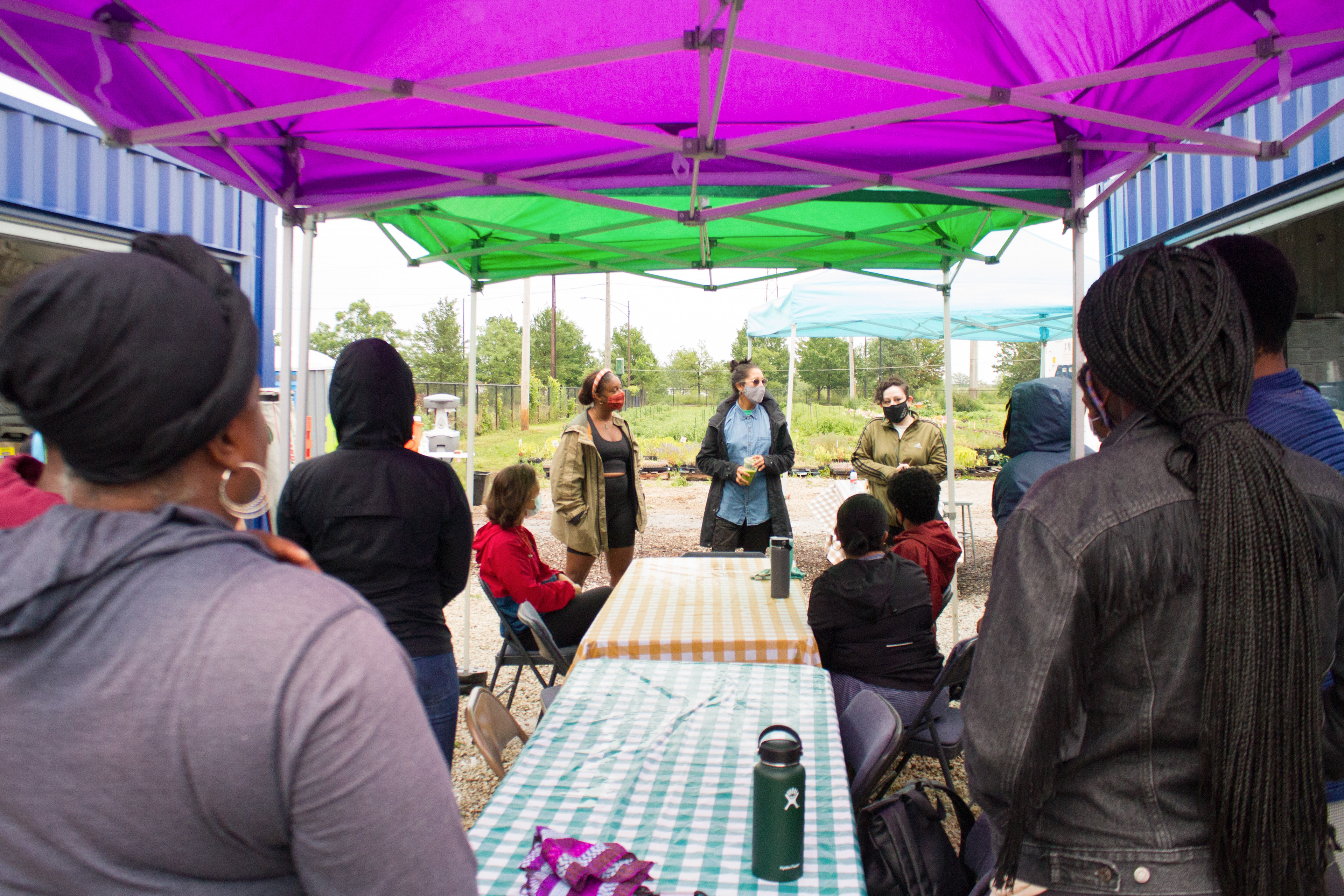 Urban Growers Collective land stewards introduce themselves to the event attendee's.