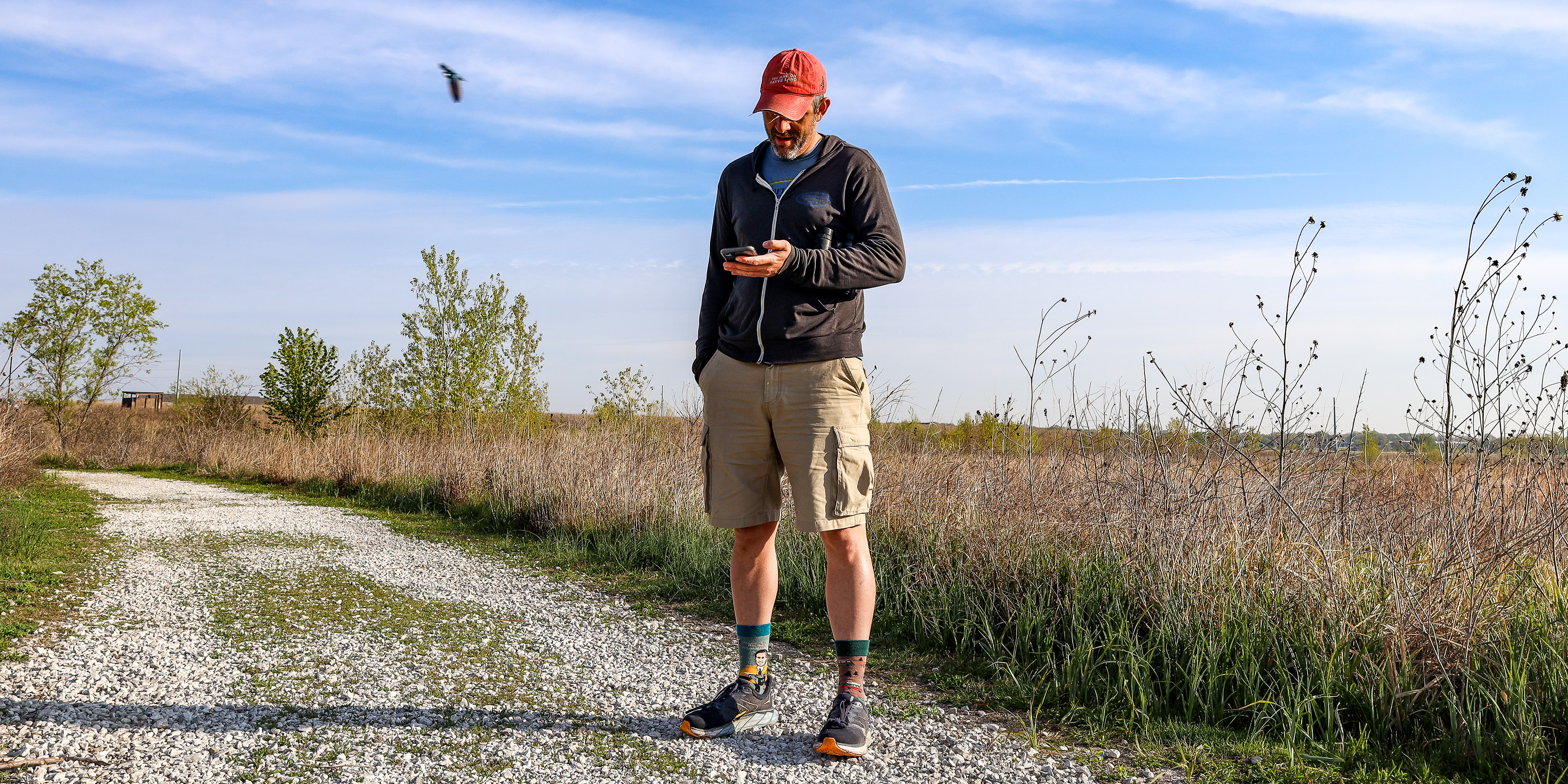 Lyles records the bird tweets that he hears from the Baker Wetlands through an app on his phone, Merlin Bird ID, on April 26. The app picked up 46 species throughout the three-mile hike, all of them previously observed by Lyles.