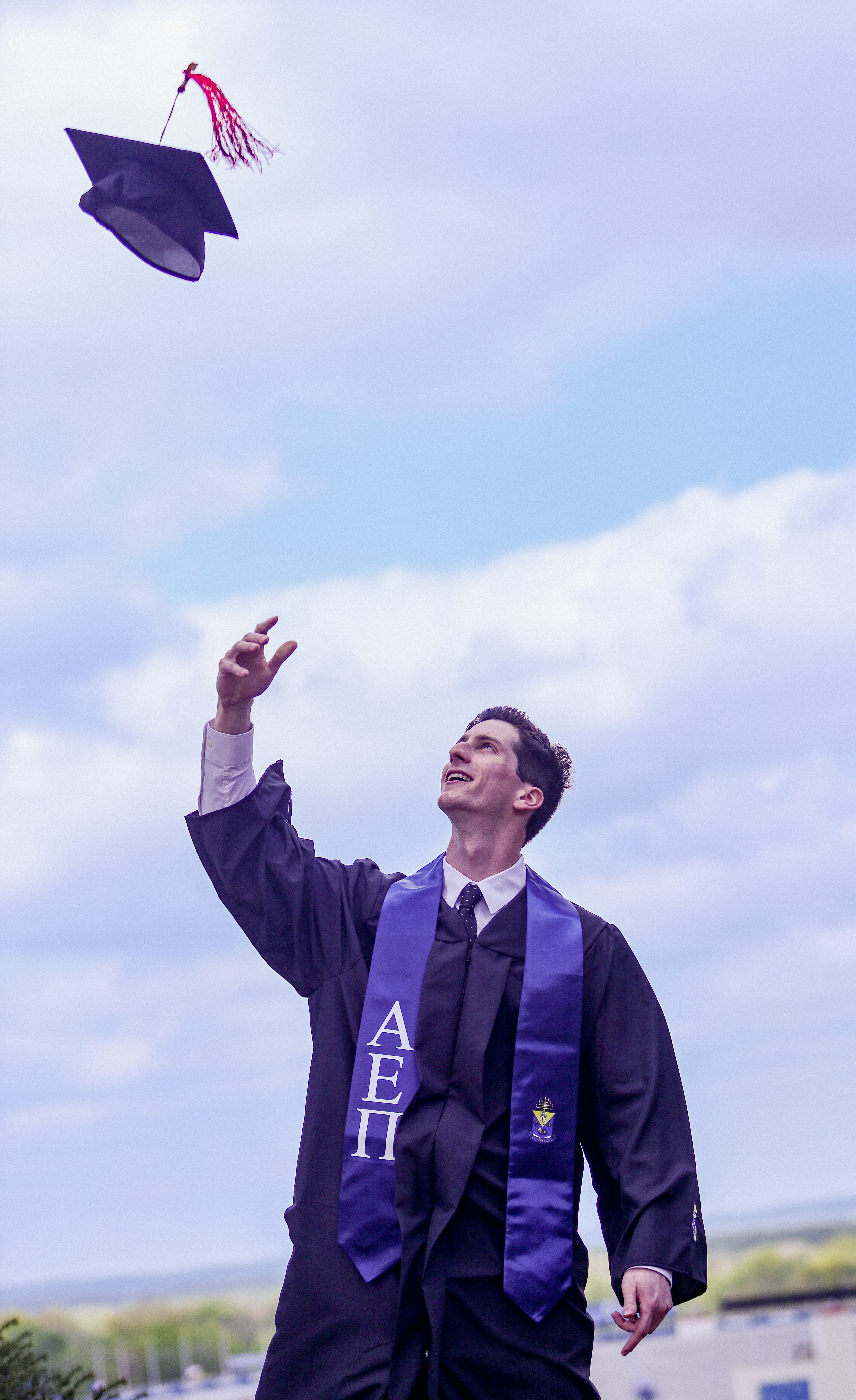Ari Chargo poses for a graduation shoot at the University of Kansas, on May 5, 2023