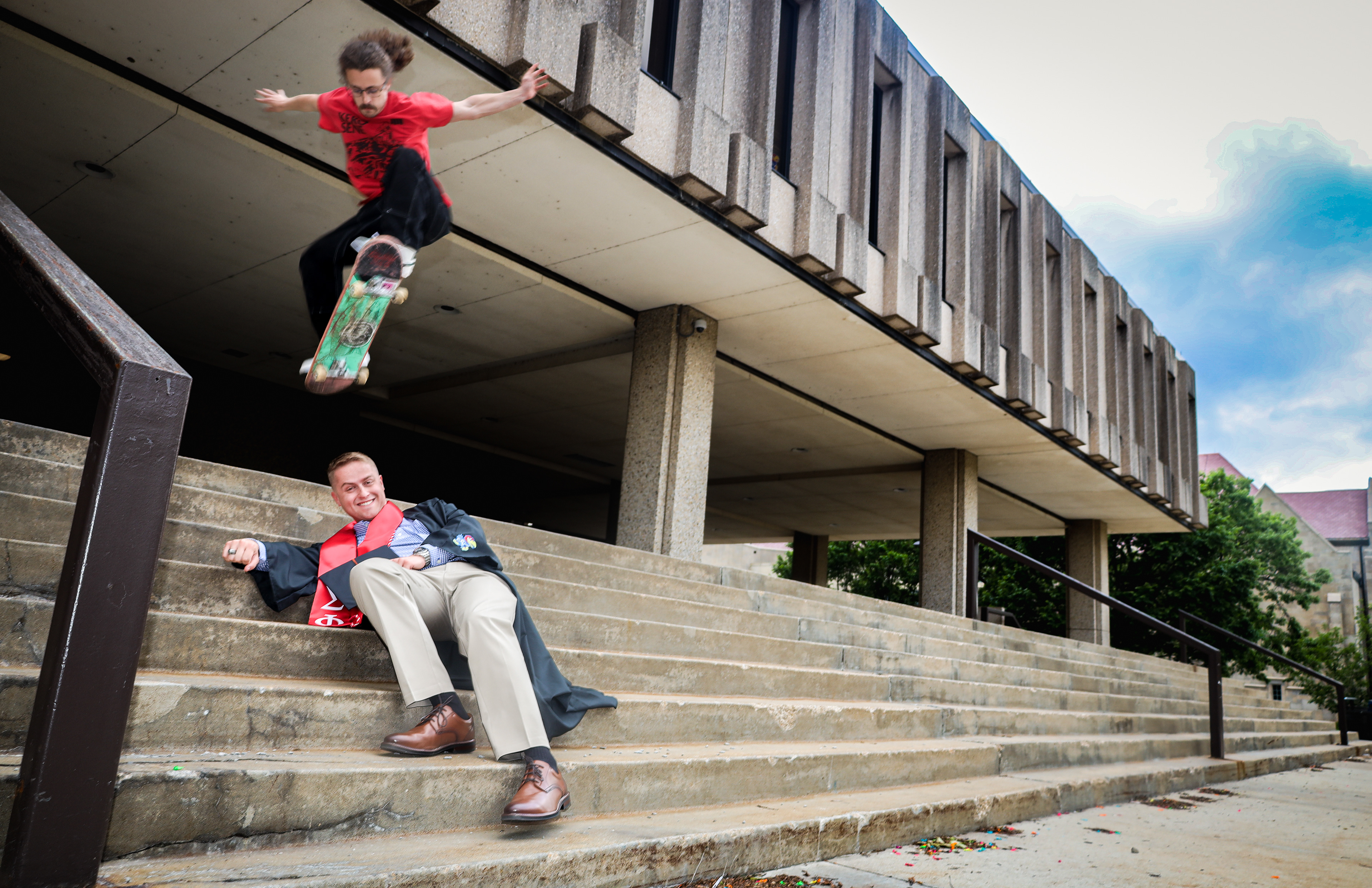 Carson Sutphin clears the eight-stair — and new graduate James Wall — in front of Wescoe Beach at the University of Kansas on May 6, 2024. Wall ran into Sutphin skating and was eager to incorporate him into the shoot.