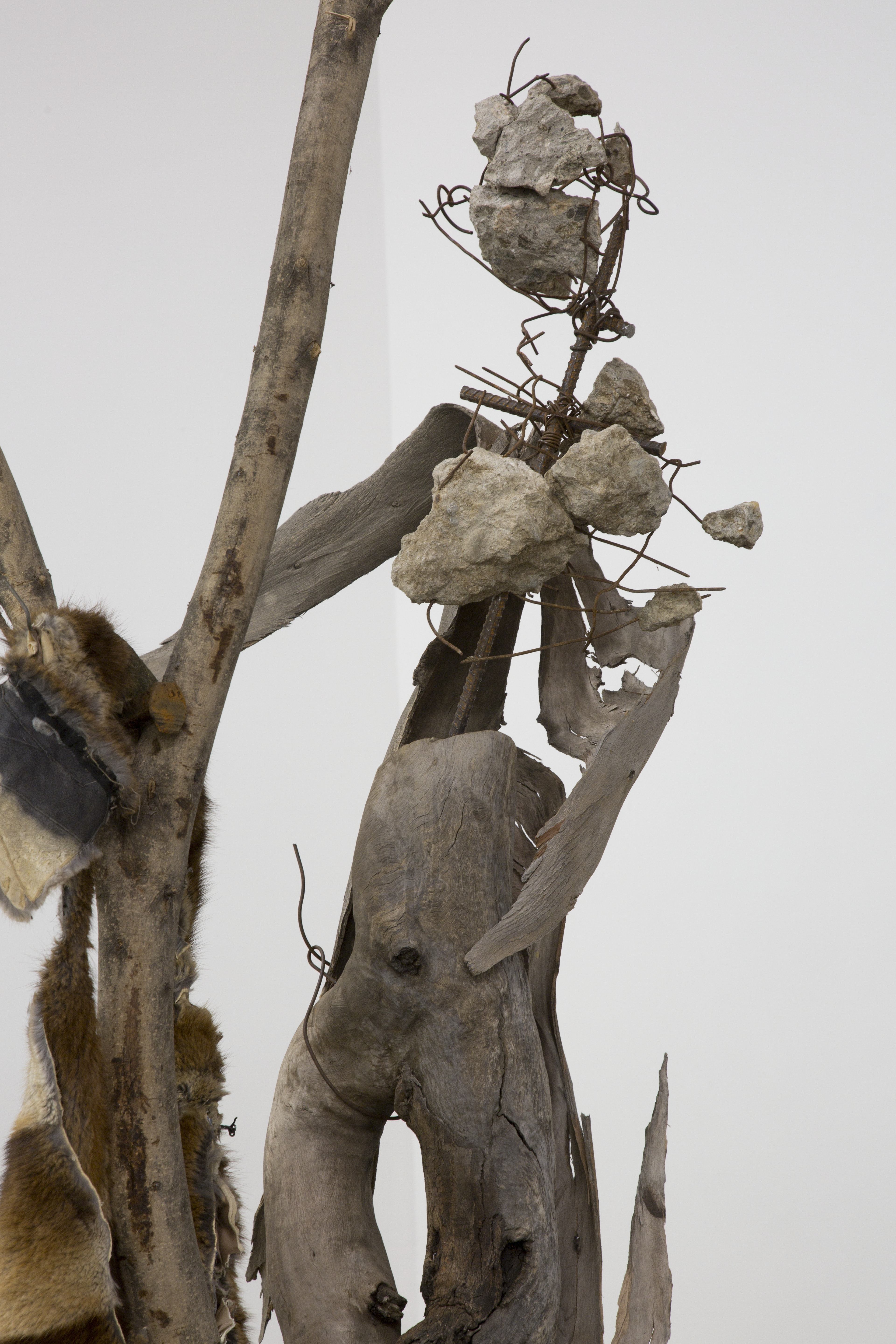 Untitled (romantic dancing), 2017. Tree branches, concrete, rebar, scrap metal, cinderblock, fur, cloth.