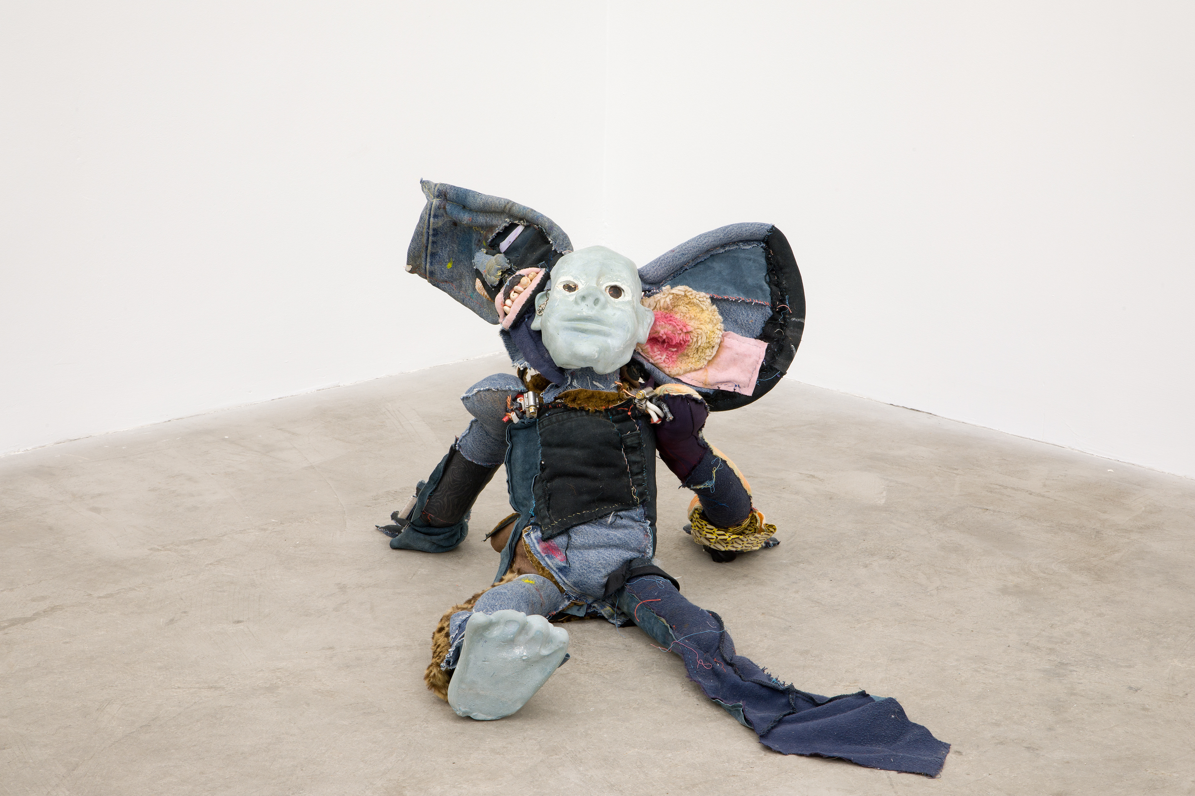 'friendliness and the whisperers', 2018. Hand sewn fabrics, furs and leathers, hand carved plaster, acrylic paint, chalk pastel, wires, hardware, cotton batting, polyester batting, human hair, sea shells, stones. 21 x 40 x 28 in (53.3 x 101.6 x 71.1 cm).
