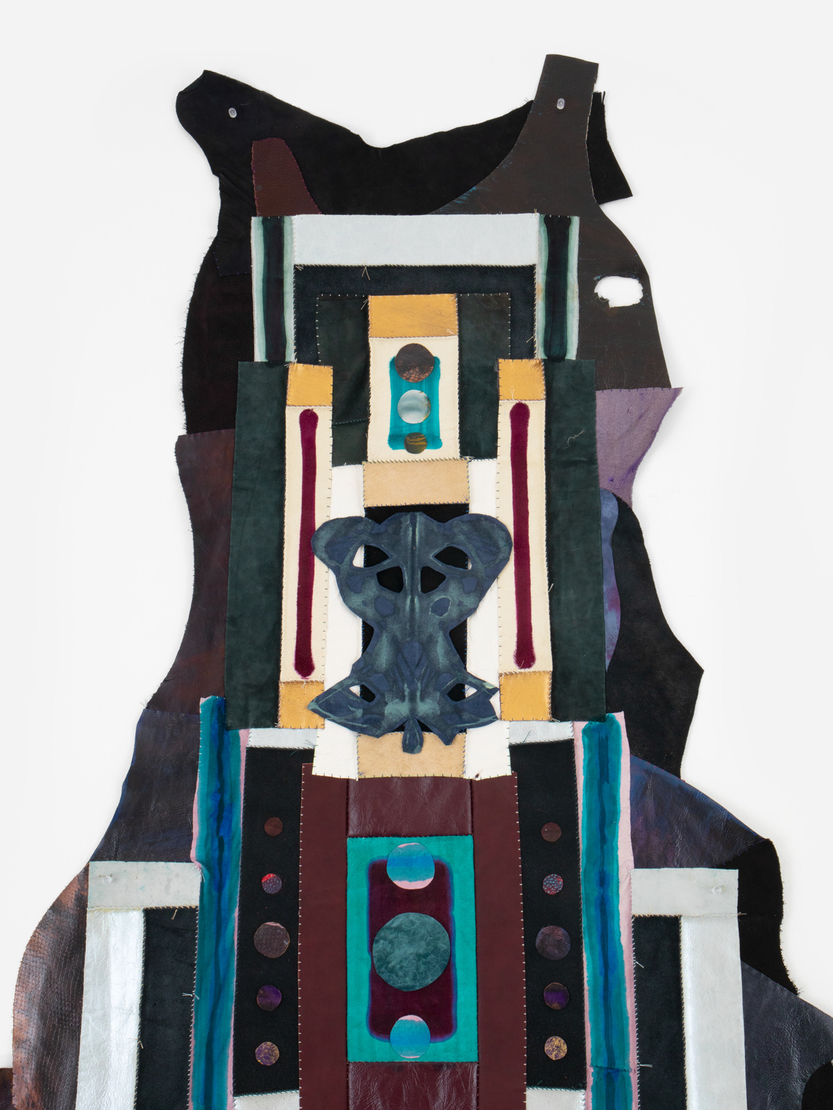 (detail) Epitaph, 2024, Repurposed leather and suede, acrylic paint and finisher, leather dye, upholstery tacks, and coated nylon thread, 100H x 47 5/8 x 1 5/8 inches