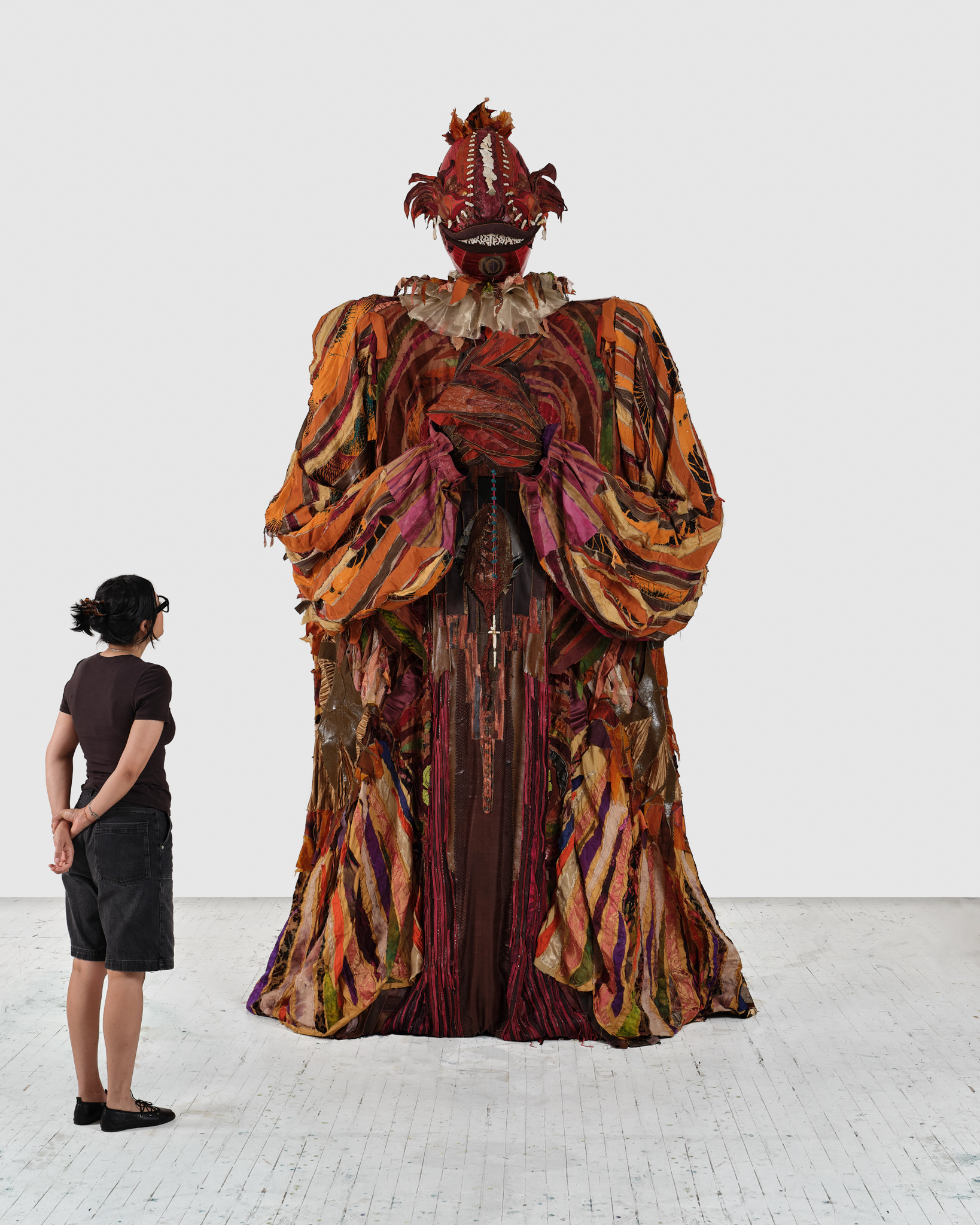 The Reaper, 2024, Steel; enamel paint; acrylic paint and finisher; repurposed leather, suede, snakeskin, goatskin and assorted fabric; leather, fabric, and natural dyes; seashells; conch; coral bone; stones; assorted found objects; wire; jute; gold and silk thread; coated nylon thread; and coated cotton thread, 139 1/2H x 64 x 64 inches