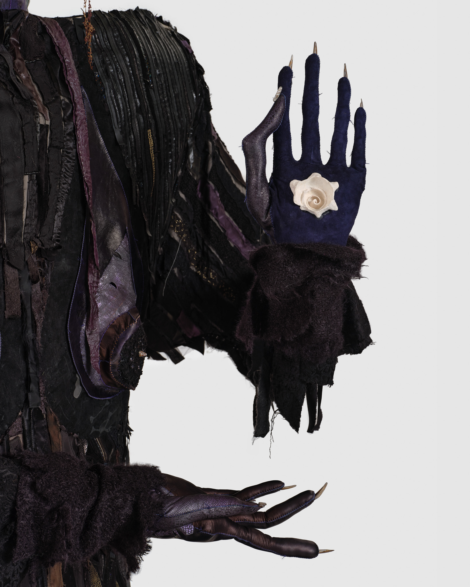 (detail) The Night Woman, 2024, Steel; enamel paint; acrylic paint and finisher; repurposed leather, suede, shearling, fur, shagreen, and assorted fabric; leather, fabric, and natural dyes; cow bone; conch; abalone shell; stones; jute; coated nylon thread; and coated cotton thread, 130H x 137 x 106 inches