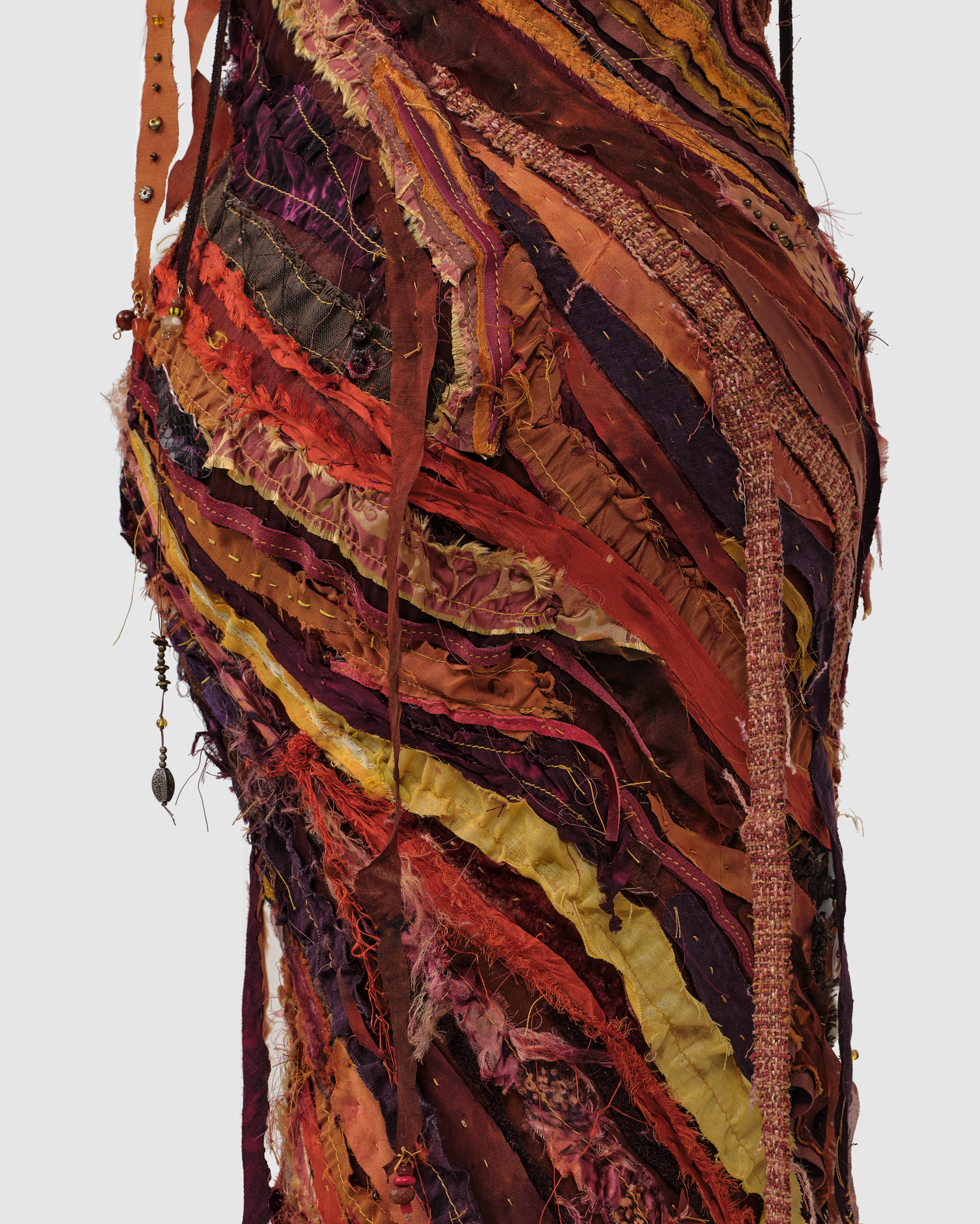 (detail) Blaze, 2024, Steel, enamel paint, acrylic paint and finisher, repurposed leather and fabric, assorted beads and found objects, seashells, and coated nylon thread, 73 1/2H x 49 x 50 1/2 inches