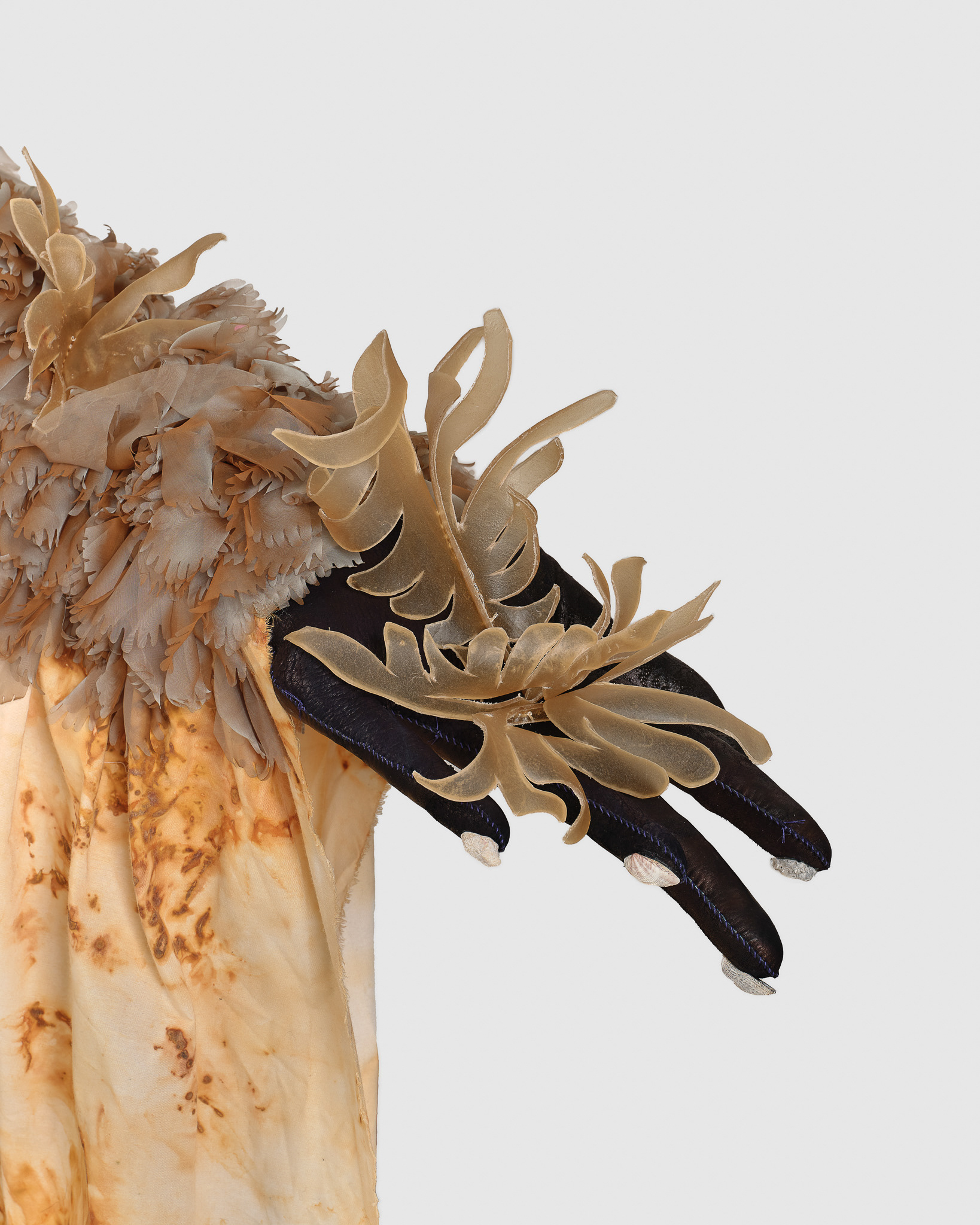 (detail) The Handle of the Axe, 2024, Steel; enamel paint; acrylic paint and finisher; repurposed leather, suede, shearling, shagreen, and assorted fabric; leather, fabric, and natural dyes; rawhide; seashells; coral bone; pearl; stones; assorted beads; assorted found objects; gold and silk thread; coated nylon thread; and coated cotton thread, 140H x 153 x 132 inches