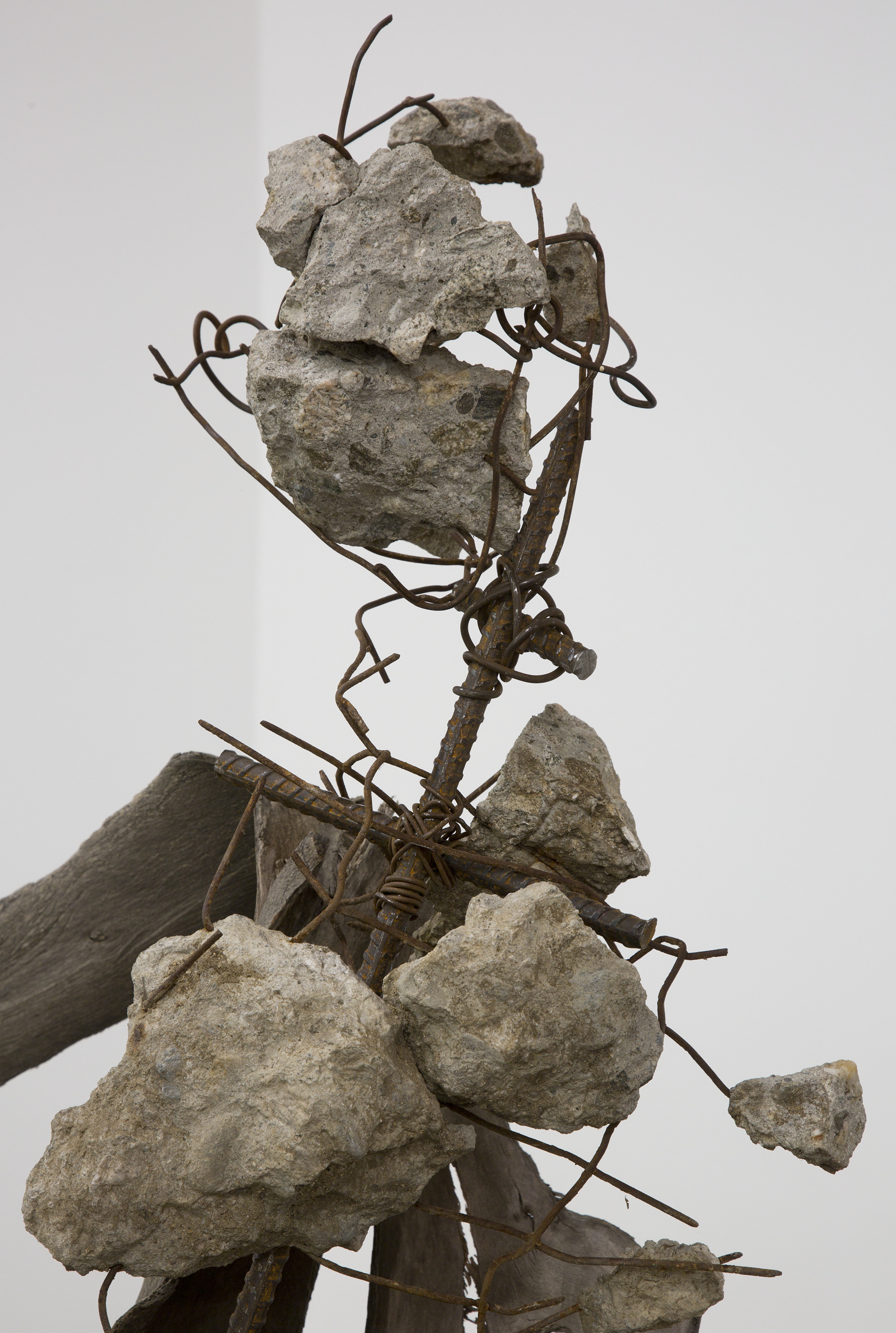 Untitled (romantic dancing), 2017. Tree branches, concrete, rebar, scrap metal, cinderblock, fur, cloth.