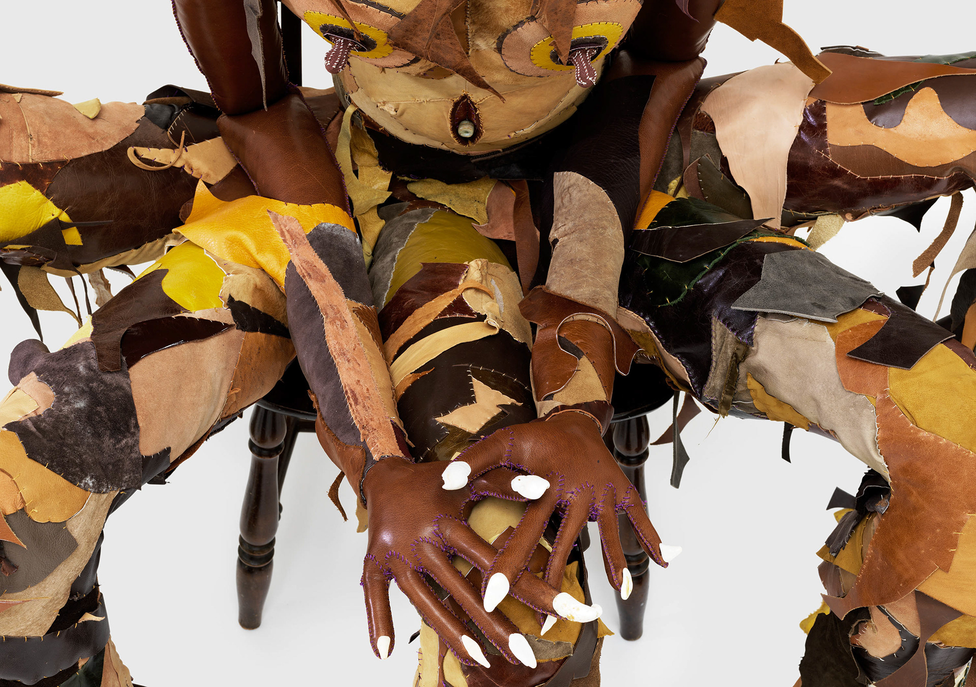 (detail) Mater Dei, 2023, Steel, enamel paint, repurposed leather, fur, shearling, suede, sea glass, conch shells, pebbles, wood, organic cotton twill, and coated nylon thread, 65 x 69 x 51 inches