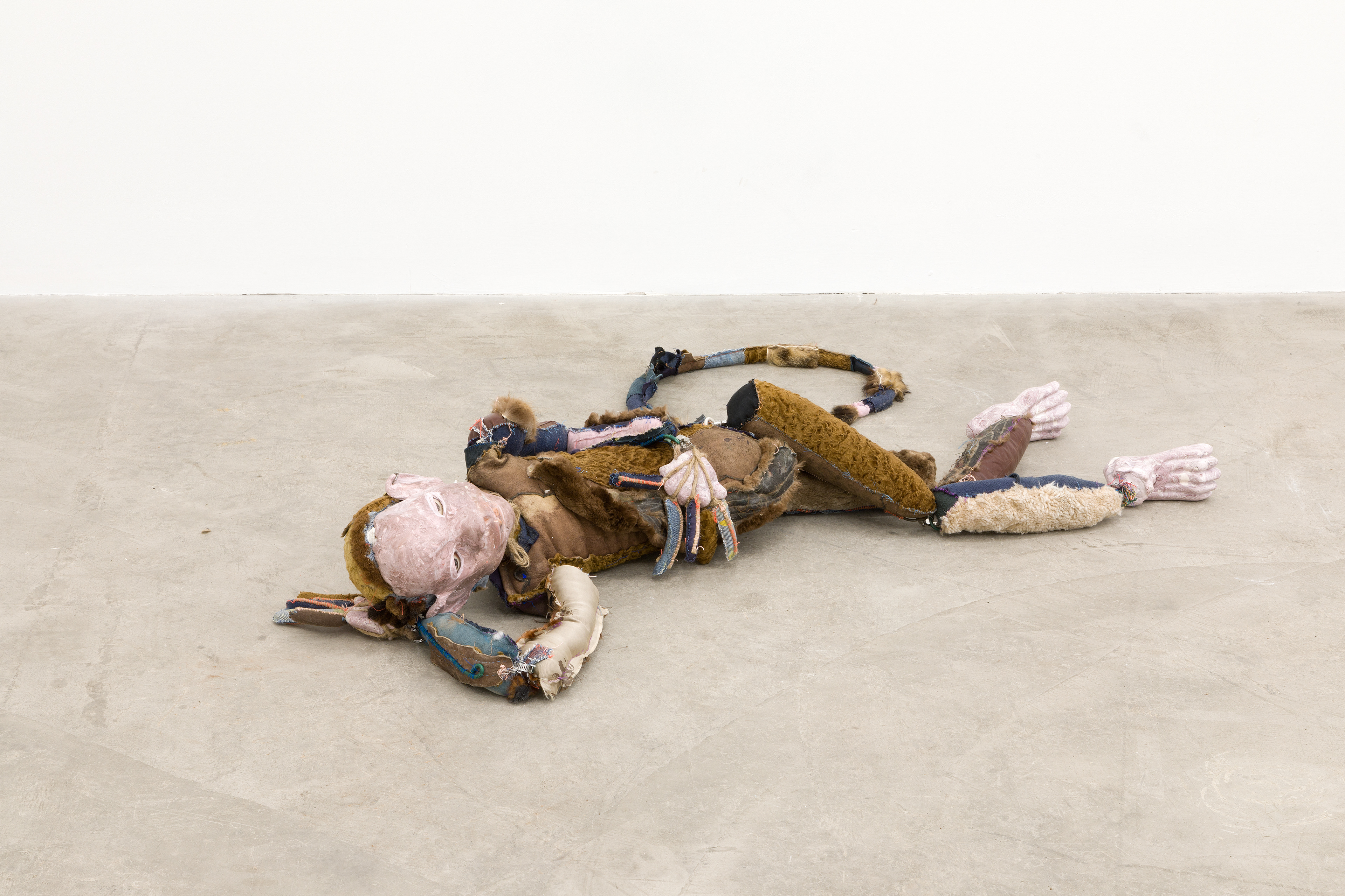 Earnest Lewis King 2017-2018. Hand carved plaster, acrylic paint, hand sewn fabric, leather, fur, jute, paint can, wire, hardware, stones, seashells, chalk pastel, human hair, cotton batting, polyester bating. 10 x 70 x 18 in (25.4 x 177.8 x 45.7 cm).