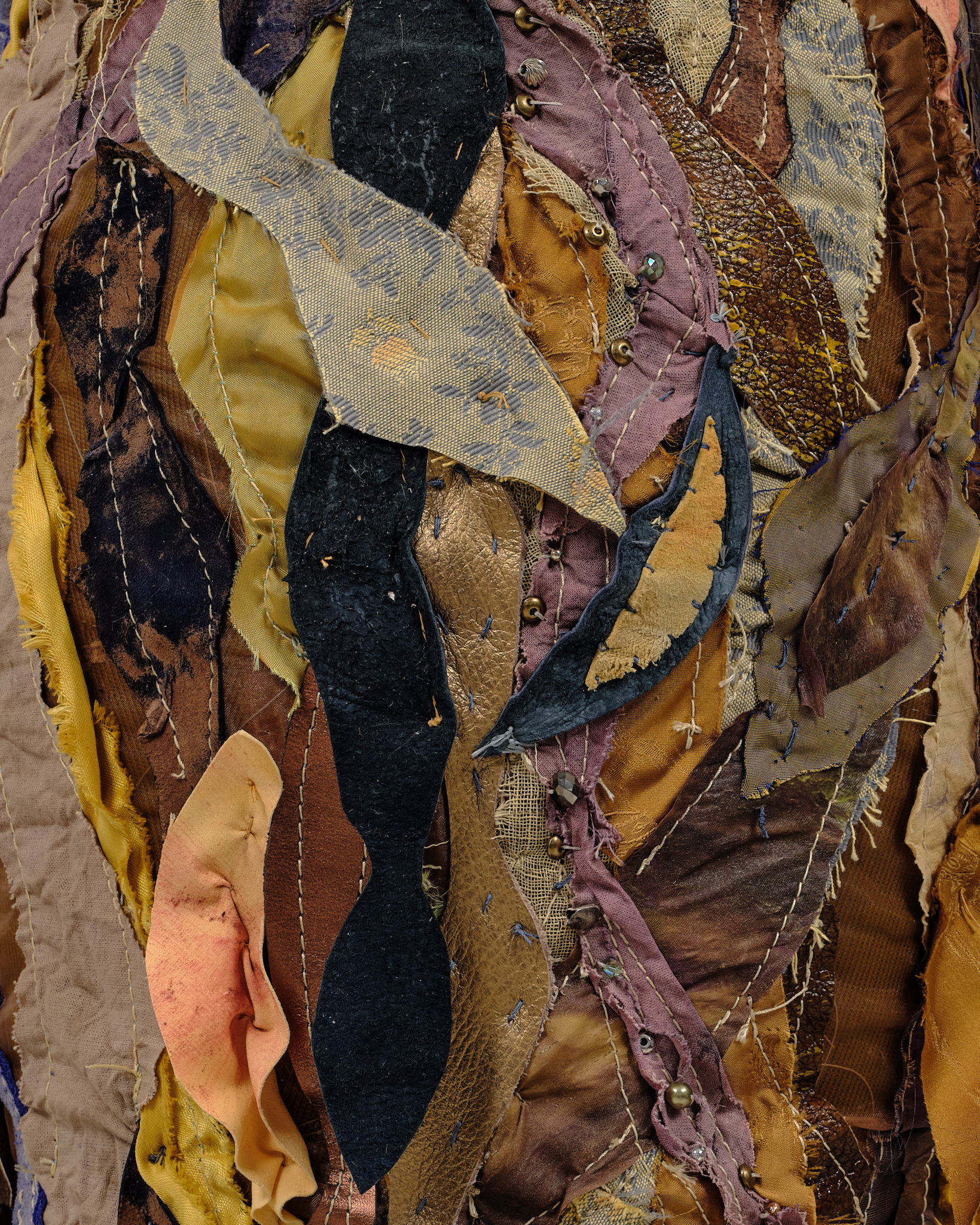 (detail) Evolver, 2024, Steel, enamel paint, acrylic paint and finisher, leather dye, repurposed leather and fabric, assorted beads, seashells, and coated nylon thread, 70 1/4H x 54 x 52 inches