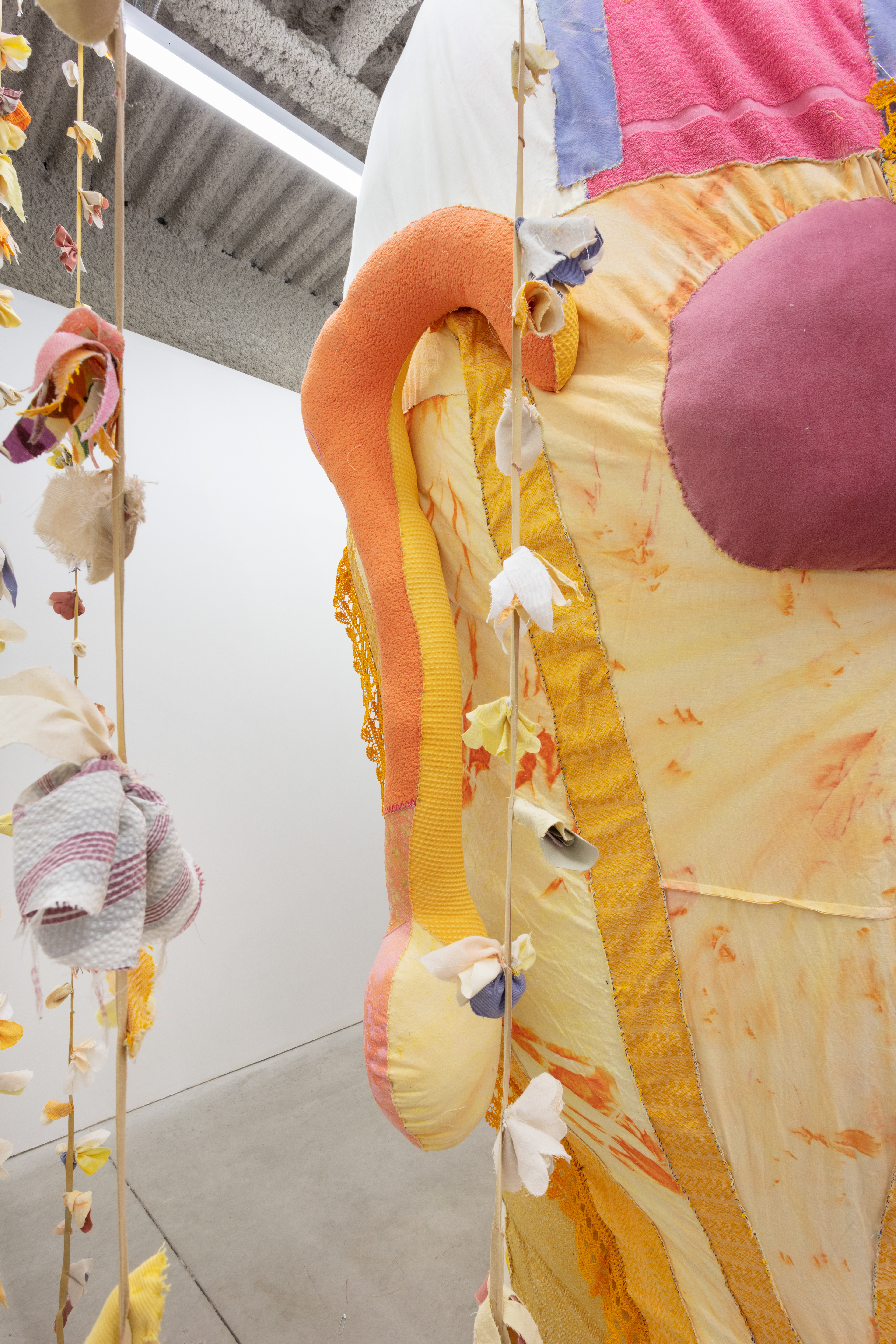 Opus (The Ovule), 2020. Various recycled and hand dyed fabrics, recycled leather, acrylic paint, recycled polyester batting, jute, metal frame, PVA glue, secret objects, safety pins, metal hooks, wire. Dimensions variable, overall: 122 x 88 x 252 in (309.9 x 223.5 x 640.1 cm).