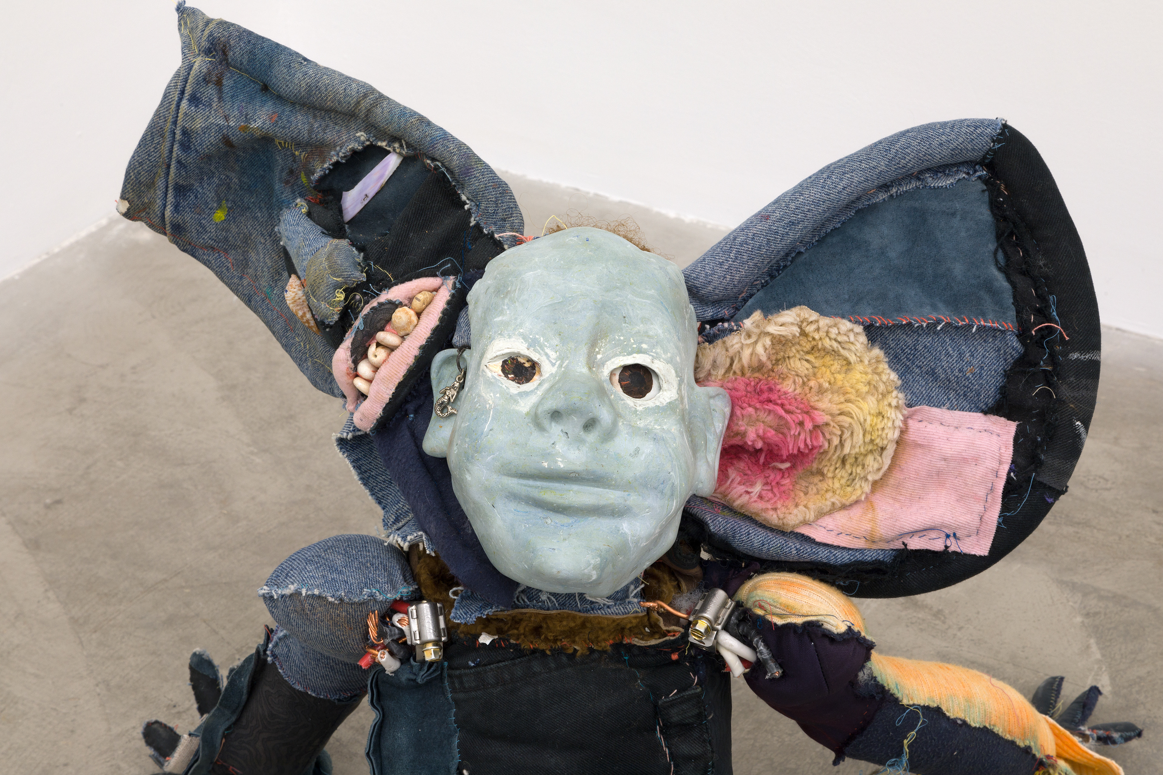 'friendliness and the whisperers', 2018. Hand sewn fabrics, furs and leathers, hand carved plaster, acrylic paint, chalk pastel, wires, hardware, cotton batting, polyester batting, human hair, sea shells, stones. 21 x 40 x 28 in (53.3 x 101.6 x 71.1 cm).