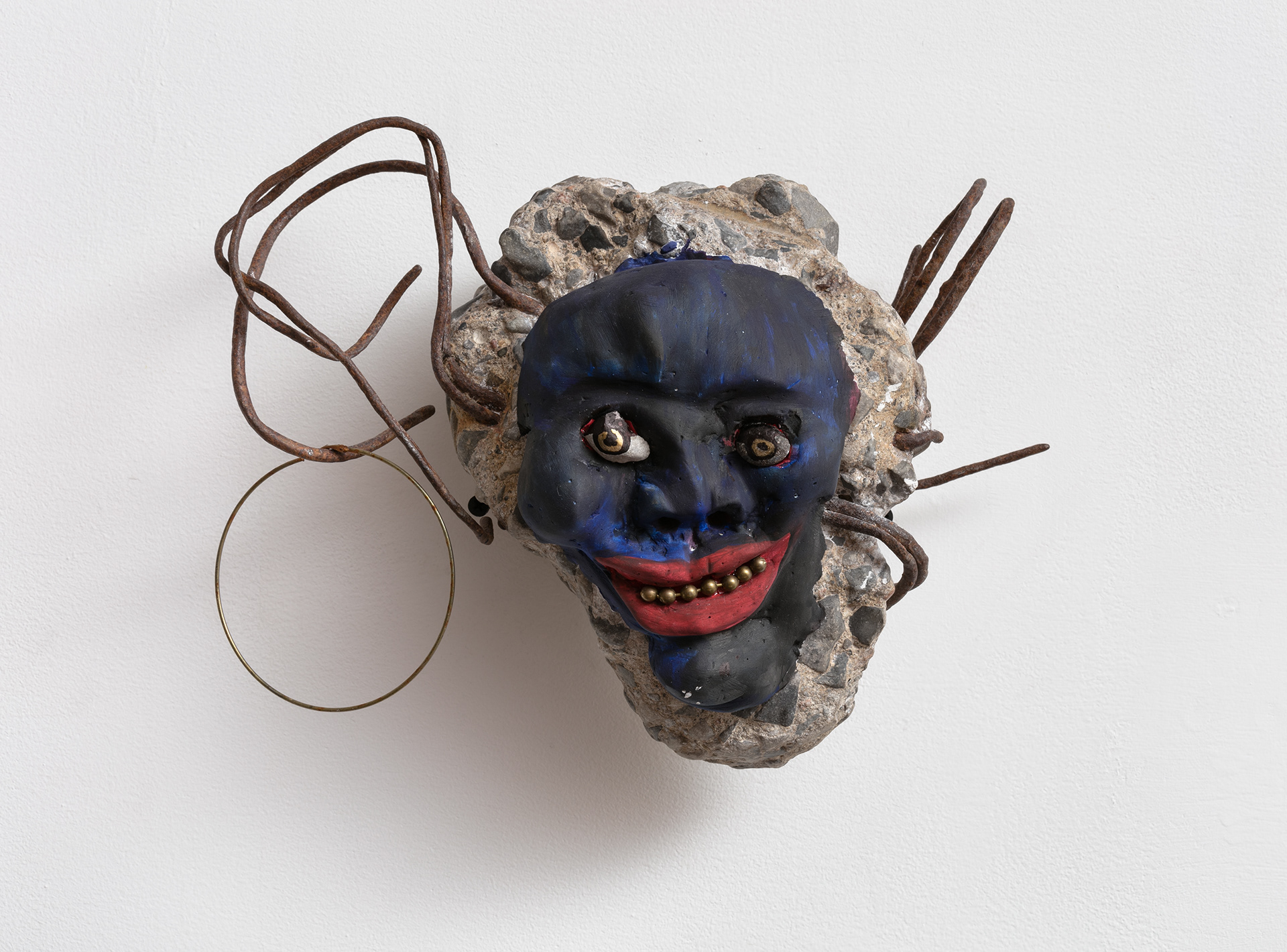 Shine eye grinner, 2018. Concrete, rebar, plaster, stones, metal beads, acrylic paint, dried flowers. 10 x 12 x 7 in (25.4 x 30.5 x 17.8 cm).