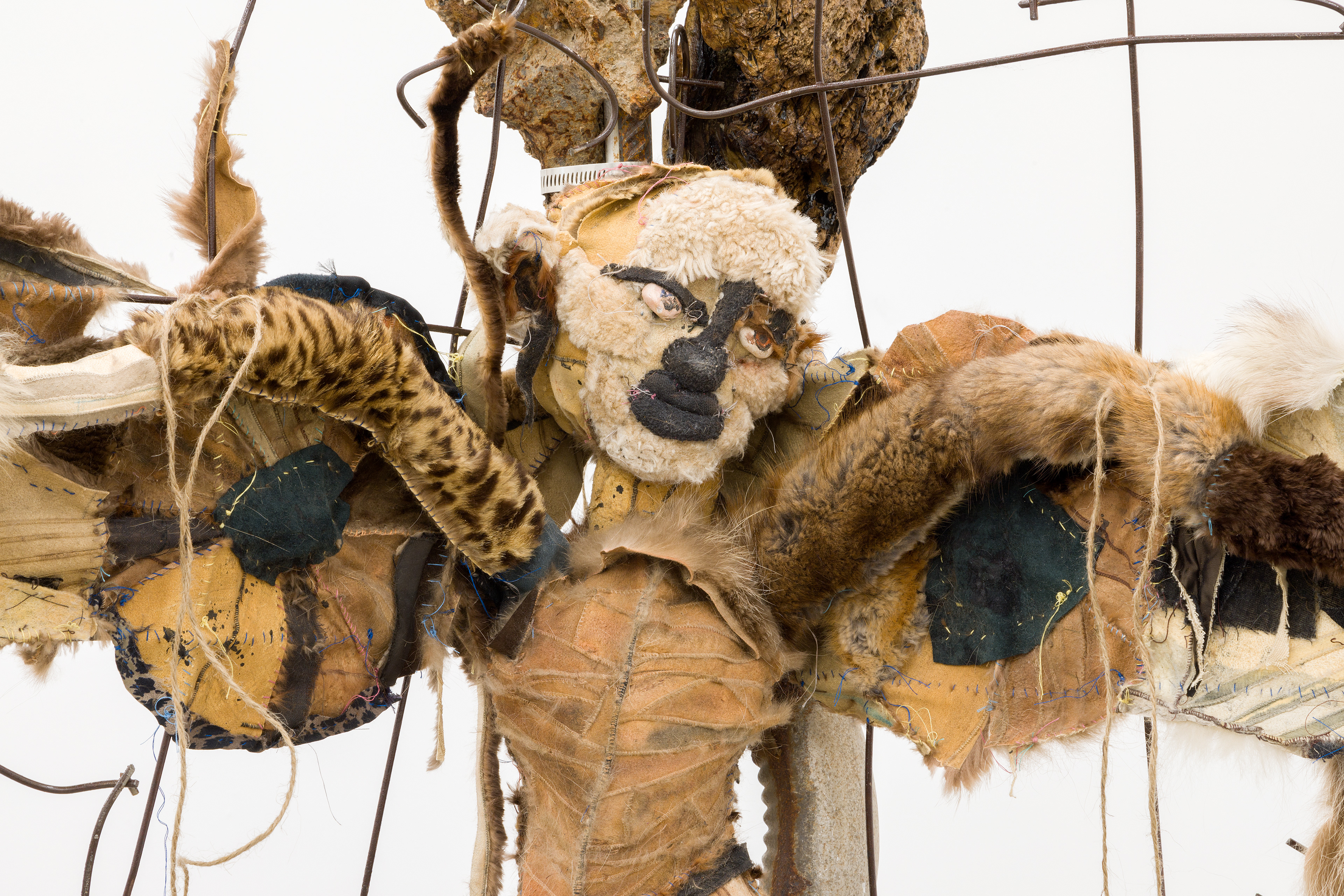 Three angels waiting, 2018. Concrete, rebar, concrete mesh, hand sewn furs, leathers and fabrics, cotton batting, stones, pipes, driftwood, dried flowers, hardware. 76 x 38 x 24 inches (193.04 x 96.52 x 60.96 cm).