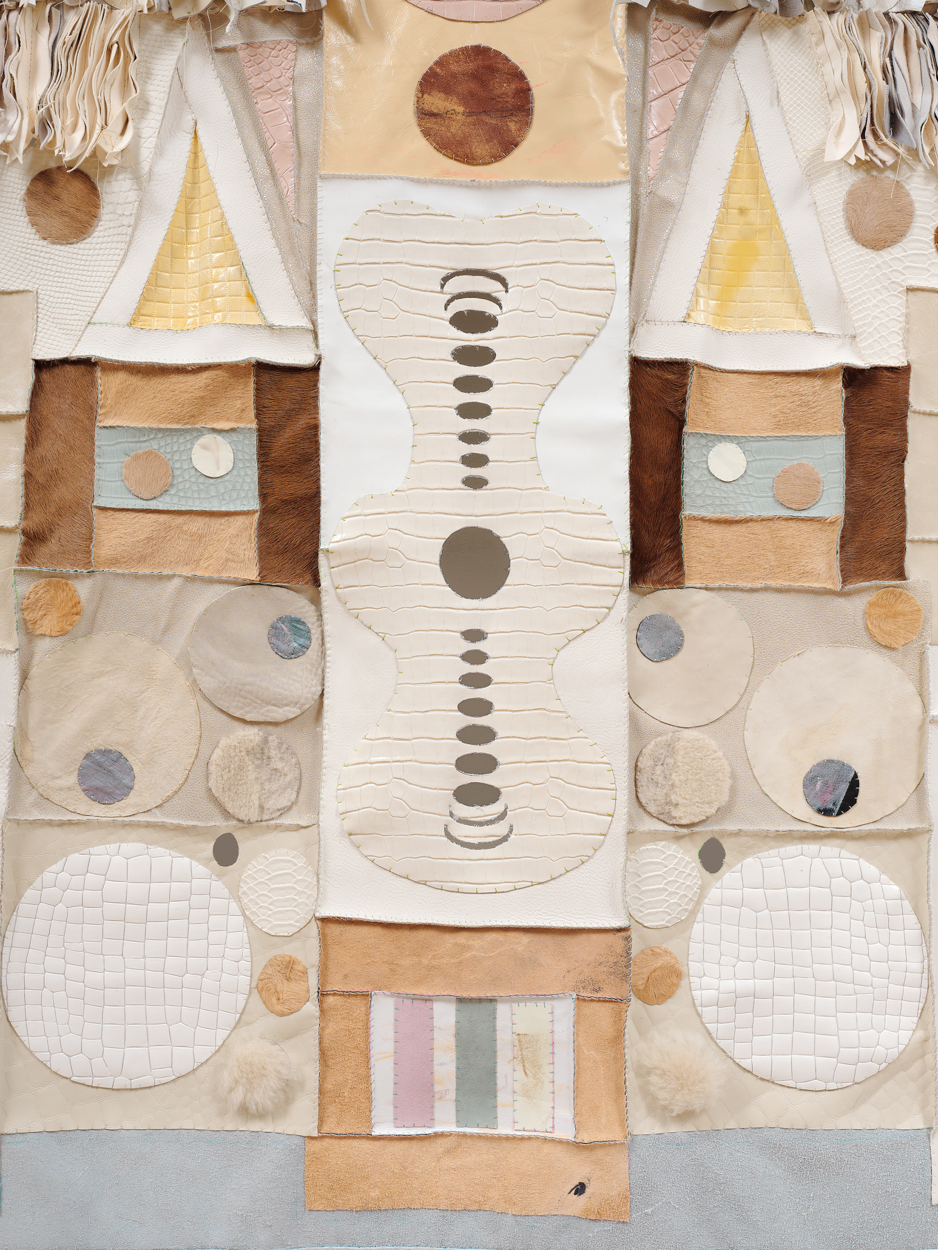 Infinity Jaw, 2022 Repurposed leather, shearling, vinyl, suede, acrylic paint, leather primer, PVA glue, wooden dowel, steel brackets.