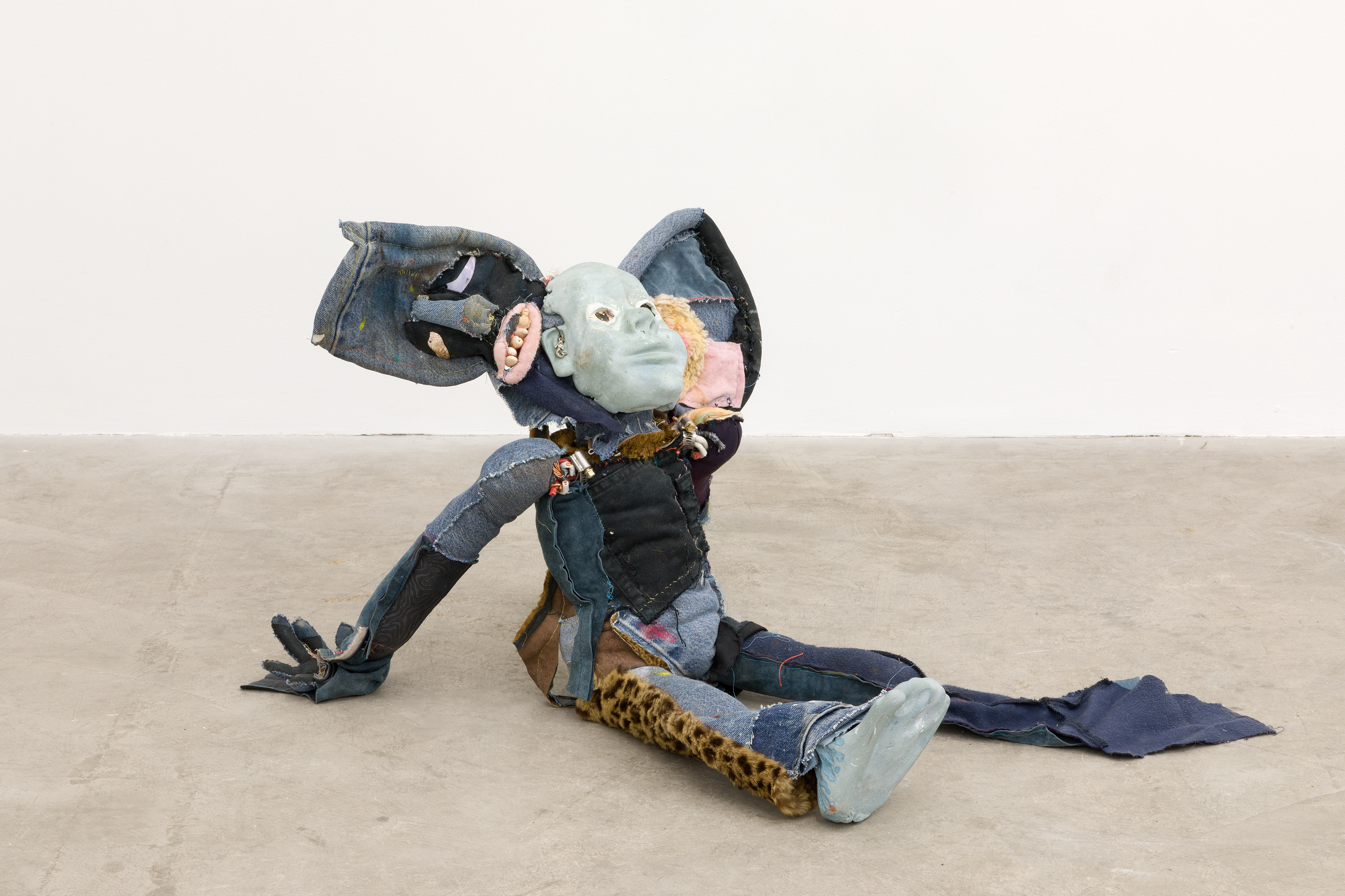 'friendliness and the whisperers', 2018. Hand sewn fabrics, furs and leathers, hand carved plaster, acrylic paint, chalk pastel, wires, hardware, cotton batting, polyester batting, human hair, sea shells, stones. 21 x 40 x 28 in (53.3 x 101.6 x 71.1 cm).