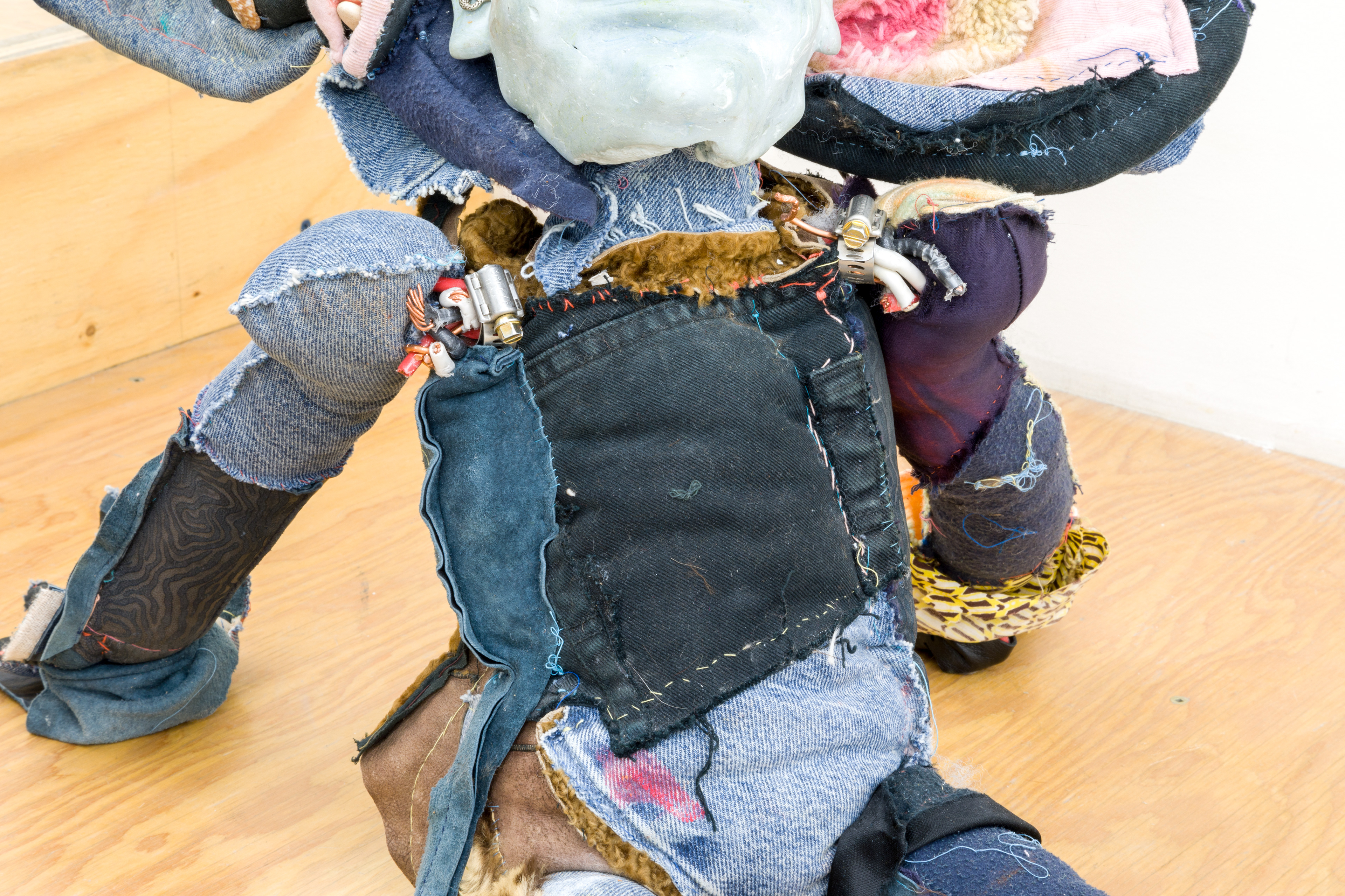 'friendliness and the whisperers', 2018. Hand sewn fabrics, furs and leathers, hand carved plaster, acrylic paint, chalk pastel, wires, hardware, cotton batting, polyester batting, human hair, sea shells, stones. 21 x 40 x 28 in (53.3 x 101.6 x 71.1 cm).
