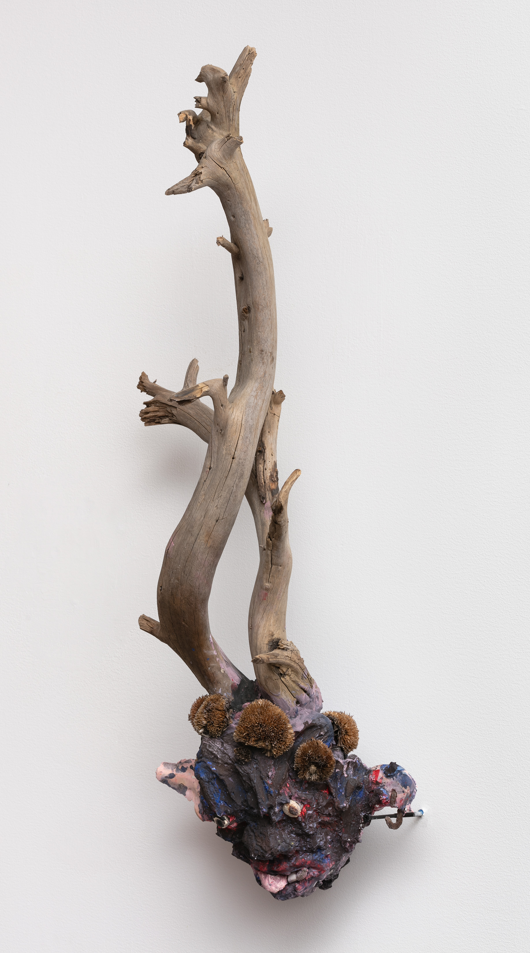 You keep pulling my heartstrings till I turn purple!, 2018. Plaster, driftwood, chain link, stones, dried flowers, acrylic paint. 28 x 12 x 9 in (71.1 x 30.5 x 22.9 cm).