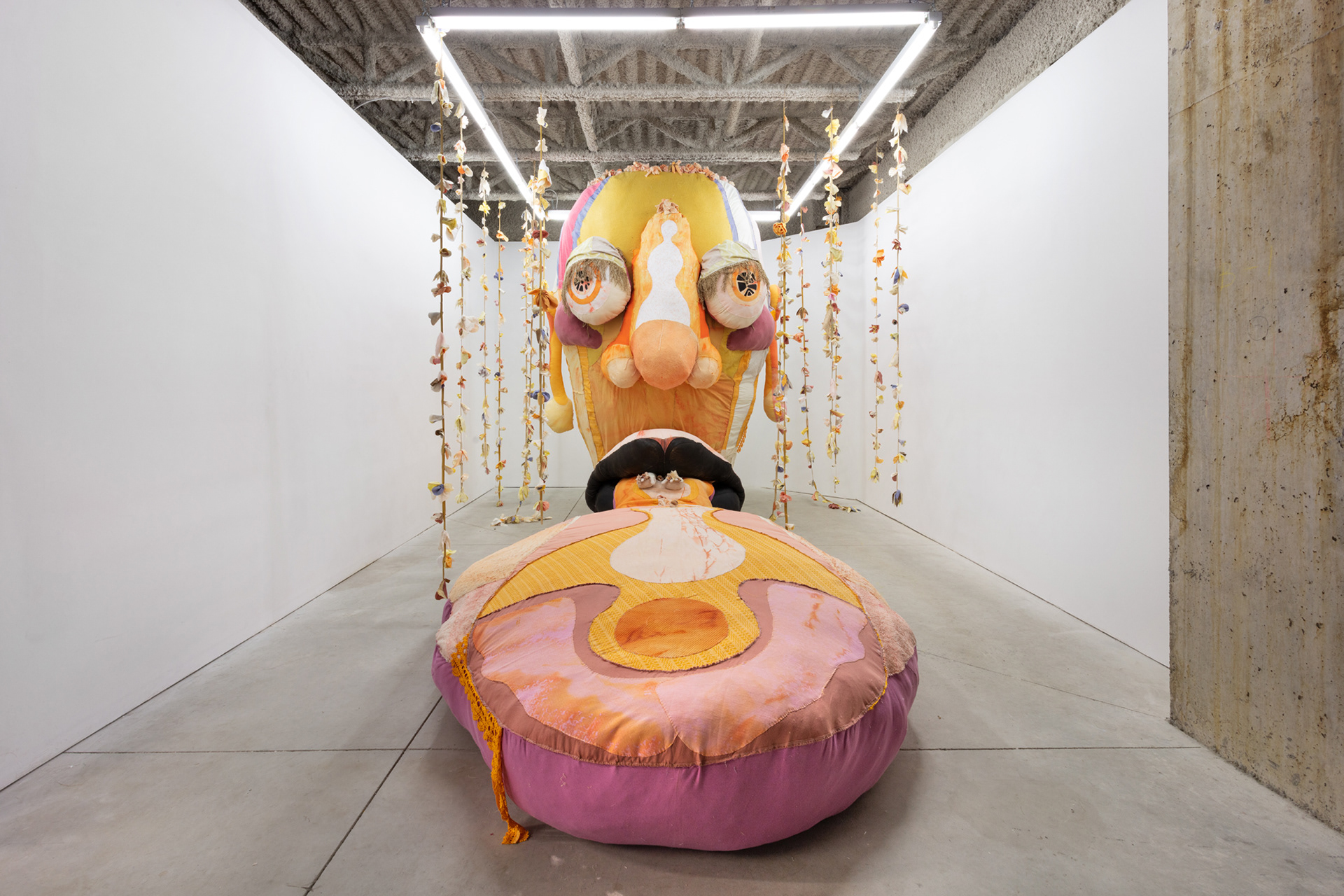 Opus (The Ovule), 2020. Various recycled and hand dyed fabrics, recycled leather, acrylic paint, recycled polyester batting, jute, metal frame, PVA glue, secret objects, safety pins, metal hooks, wire. Dimensions variable, overall: 122 x 88 x 252 iOpus (The Ovule), 2020. Various recycled and hand dyed fabrics, recycled leather, acrylic paint, recycled polyester batting, jute, metal frame, PVA glue, secret objects, safety pins, metal hooks, wire. Dimensions variable, overall: 122 x 88 x 252 in (309.9 x 223.5 x 640.1 cm). n (309.9 x 223.5 x 640.1 cm).