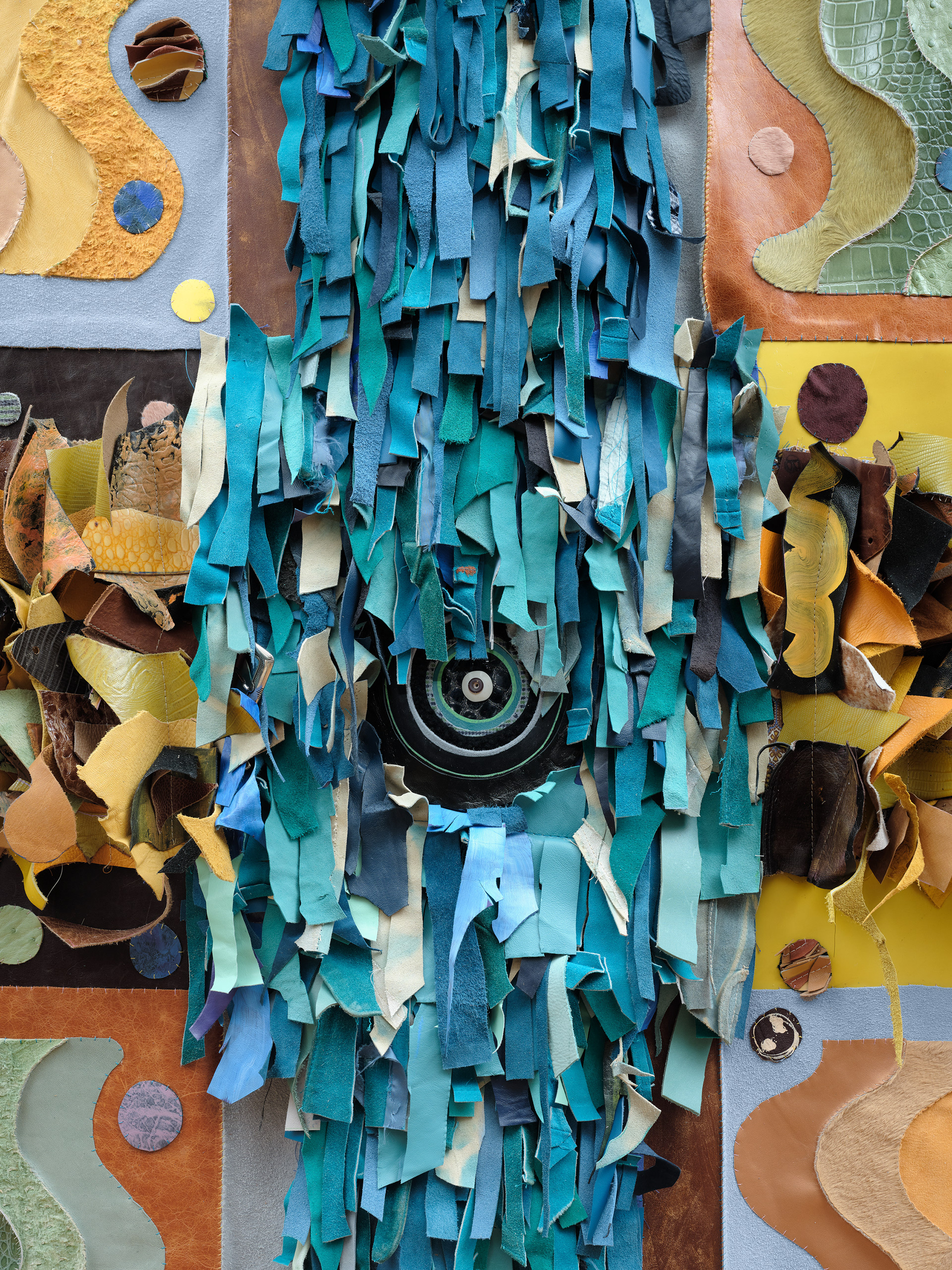 Return of the Martian Water God, 2022 Repurposed leather, vinyl, suede, acrylic paint, leather primer, PVA glue, leather cement, cattle bone bead, dutch trading bead, wooden dowel, steel bracket. 68 inches x 110 inches x 10 inches.