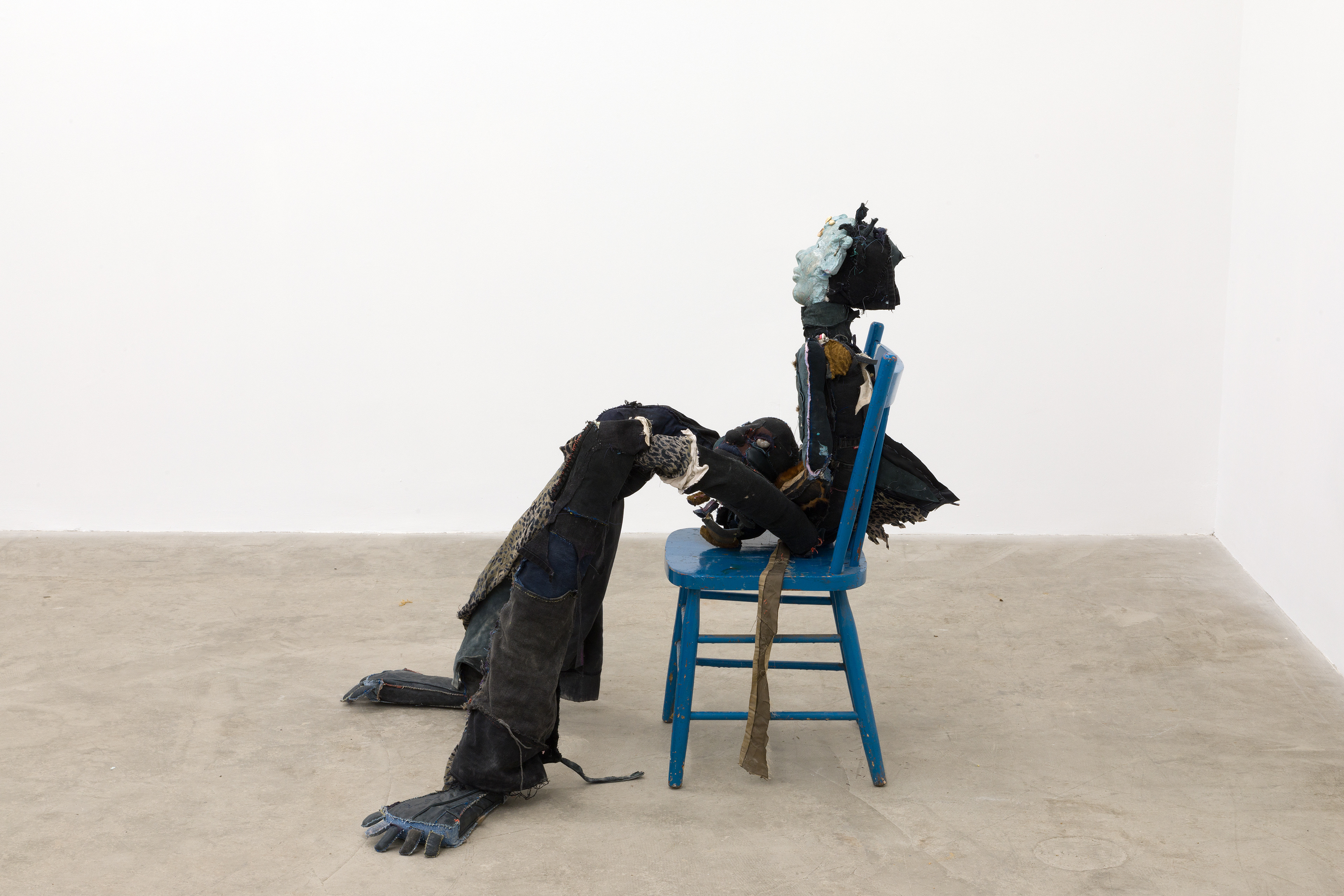 Dainty the mermaid, 2018. Hand sewn fabrics, furs and leathers, hand carved plaster, acrylic paint, copper pipes, polyester stuffing, wire, concrete, seashells, stones and wooden chair. 40 x 29 x 40 in (101.6 x 73.7 x 101.6 cm).