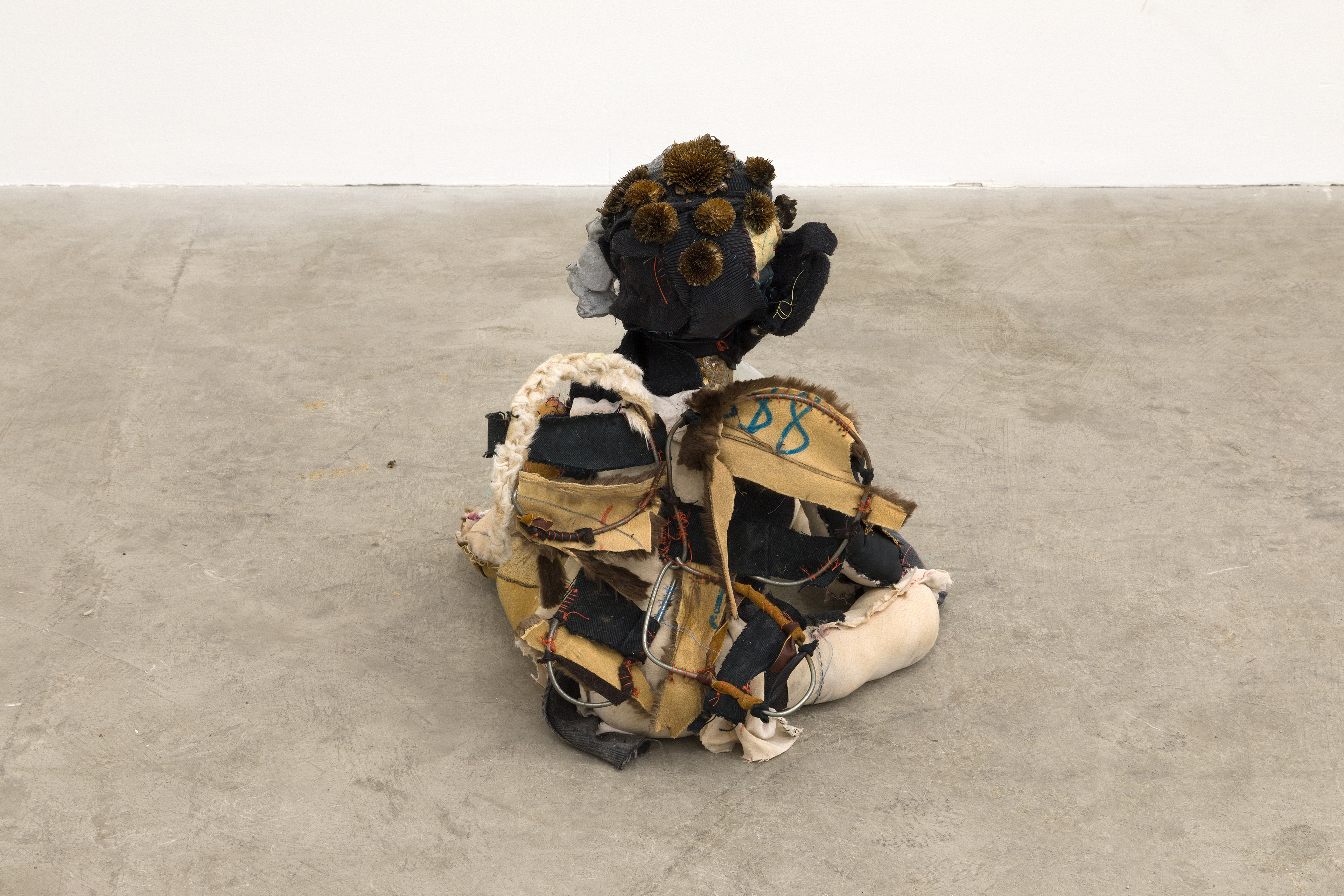 Baby bumblebee (for the betterment of us all please remember your smallness) 2018. Hand sewn fabrics, furs and leathers, hand carved plaster, acrylic paint, wire, stones, dried flowers, concrete, glass ball, salt and pepper shakers, cotton batting. 16 x 18 x 18 in (40.64 x 45.72 x 45.72 cm).