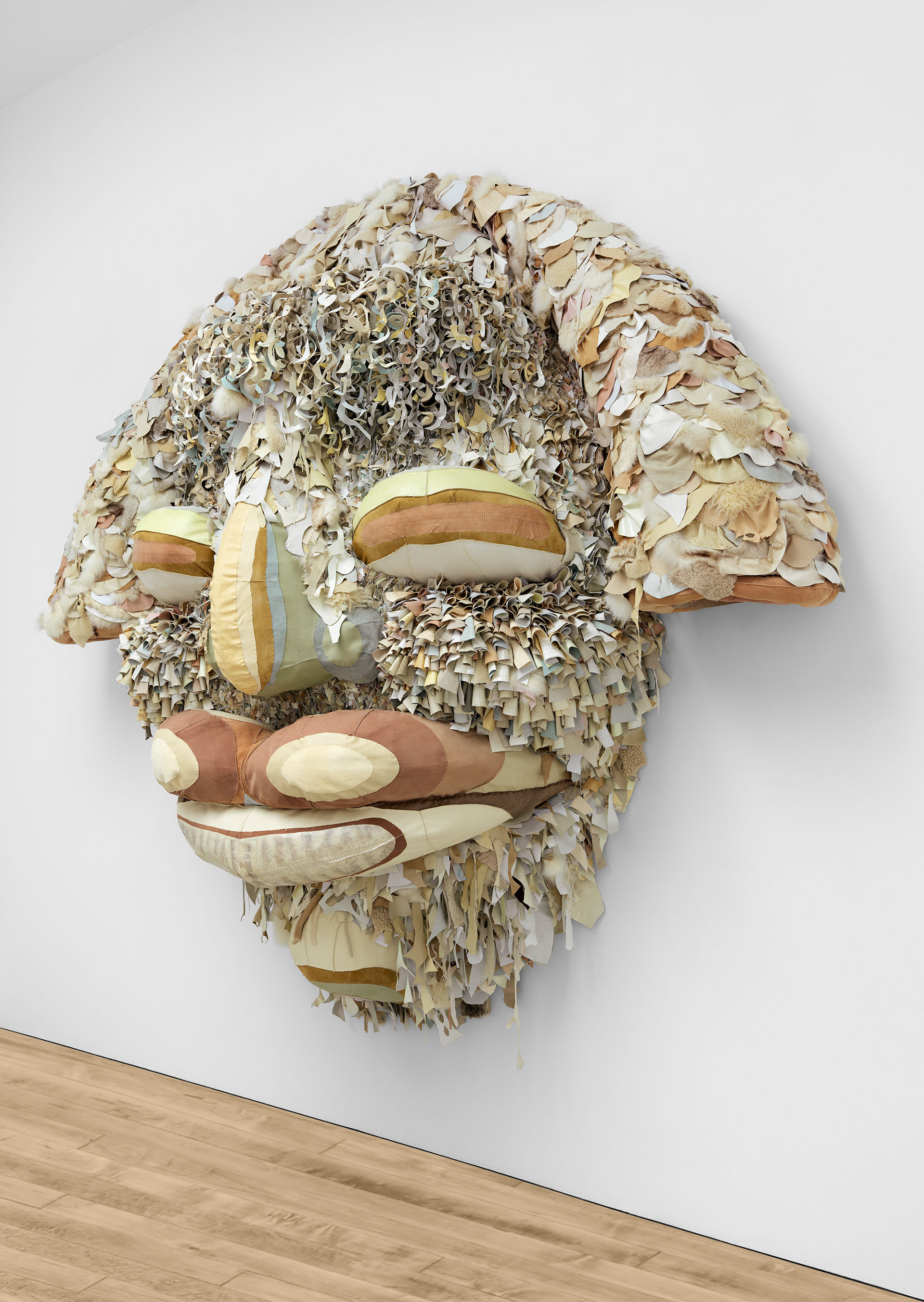 Ivory Gate, 2022, Steel, enamel paint, acrylic paint and finisher, repurposed leather, suede, fur, shearling, snake skin, shells, fossilized teeth, organic cotton twill, and coated nylon thread, 124 1/2 x 137 1/8 x 37 1/2 inches