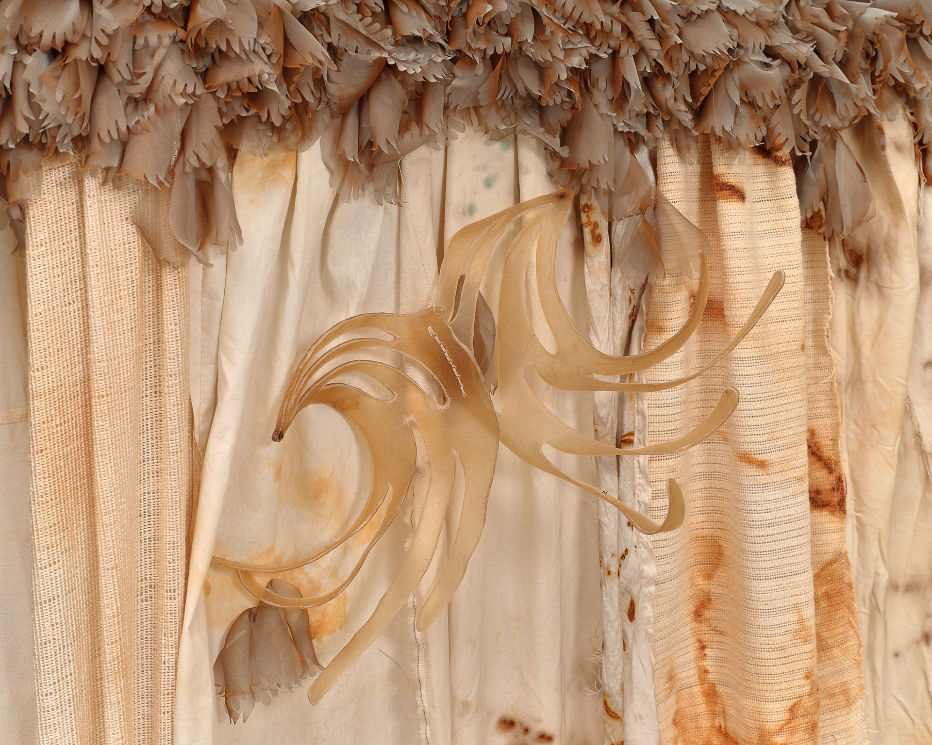 (detail) The Handle of the Axe, 2024, Steel; enamel paint; acrylic paint and finisher; repurposed leather, suede, shearling, shagreen, and assorted fabric; leather, fabric, and natural dyes; rawhide; seashells; coral bone; pearl; stones; assorted beads; assorted found objects; gold and silk thread; coated nylon thread; and coated cotton thread, 140H x 153 x 132 inches