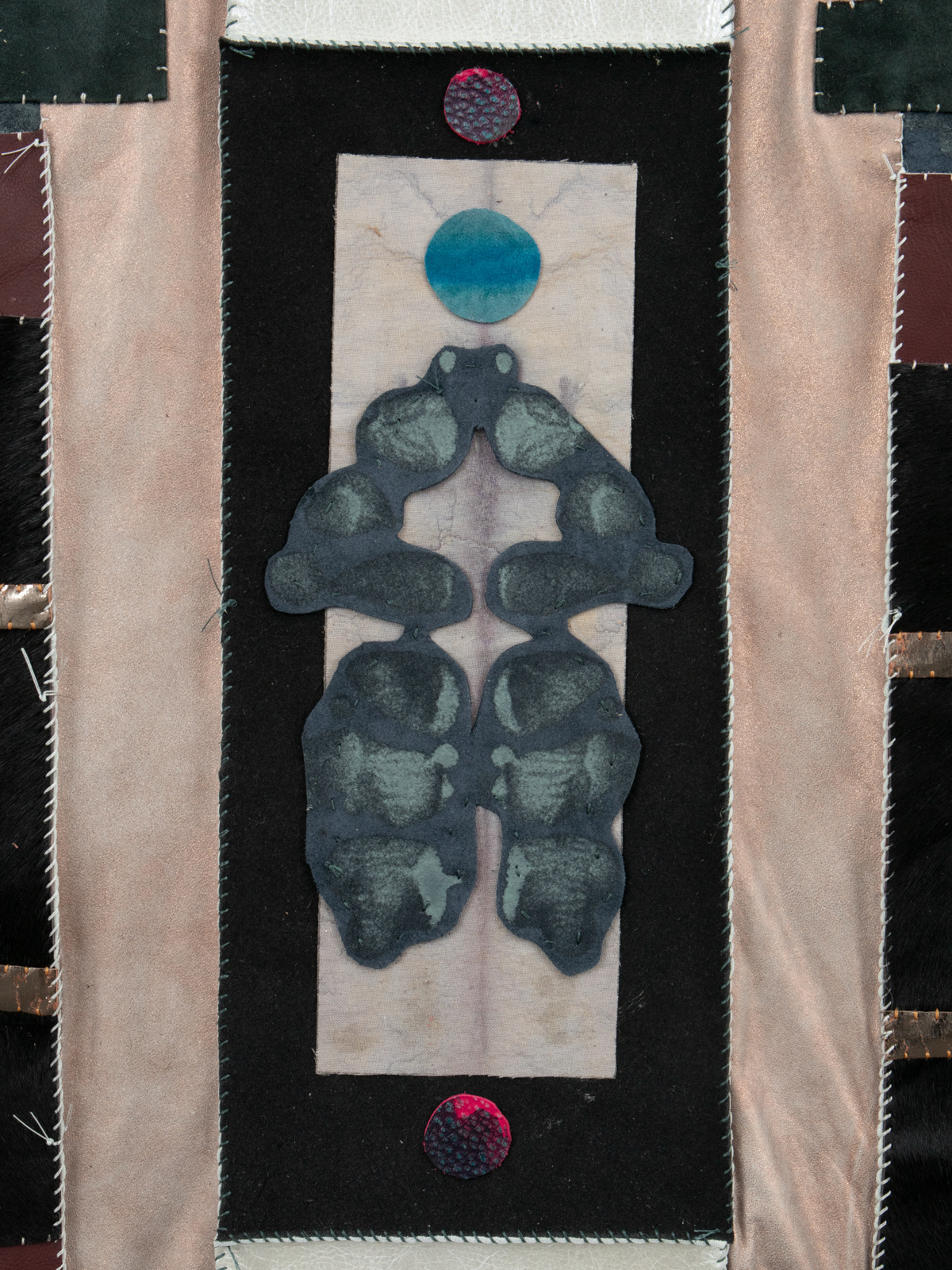 (detail) Epitaph, 2024, Repurposed leather and suede, acrylic paint and finisher, leather dye, upholstery tacks, and coated nylon thread, 100H x 47 5/8 x 1 5/8 inches