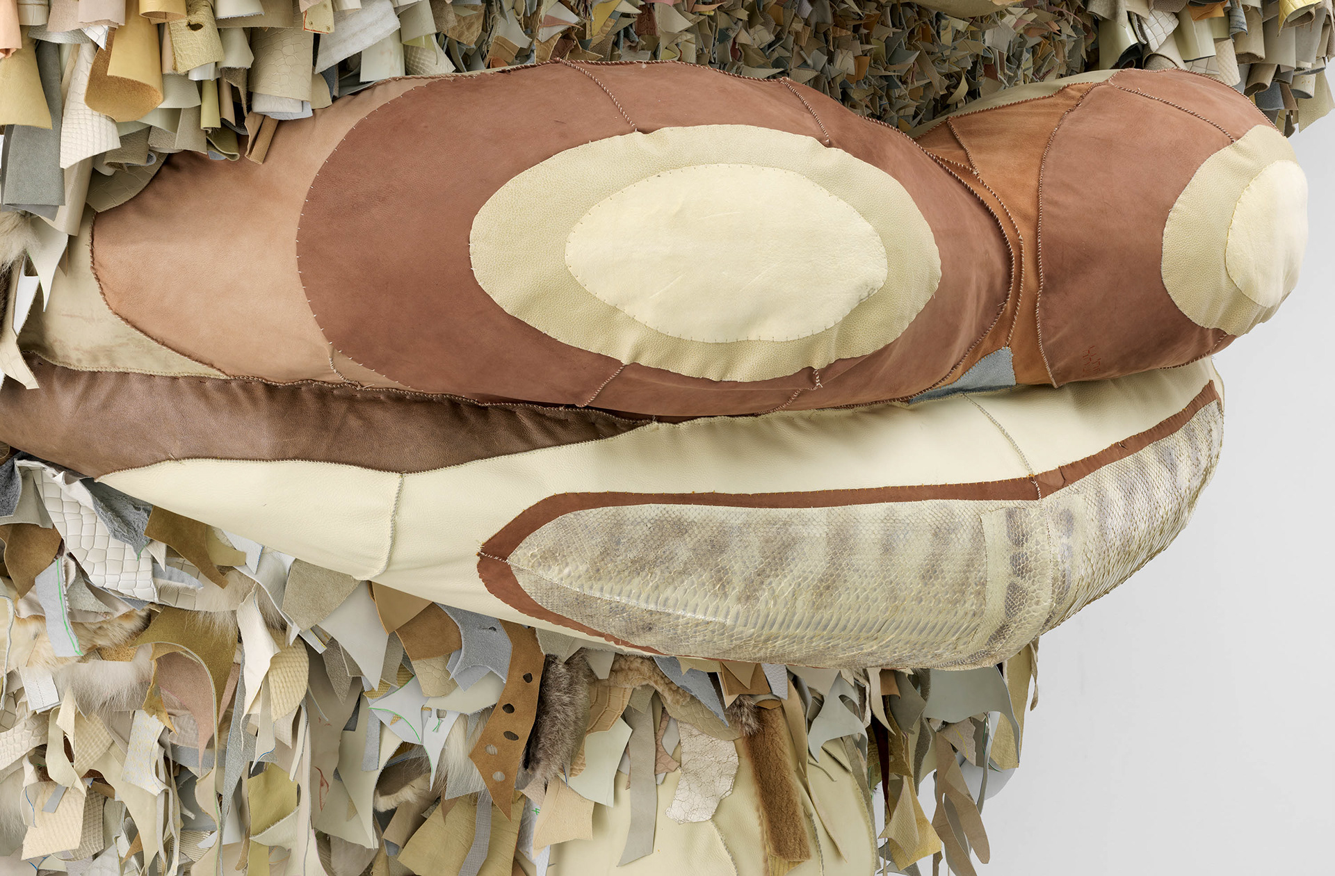 (detail) Ivory Gate, 2022, Steel, enamel paint, acrylic paint and finisher, repurposed leather, suede, fur, shearling, snake skin, shells, fossilized teeth, organic cotton twill, and coated nylon thread, 124 1/2 x 137 1/8 x 37 1/2 inches