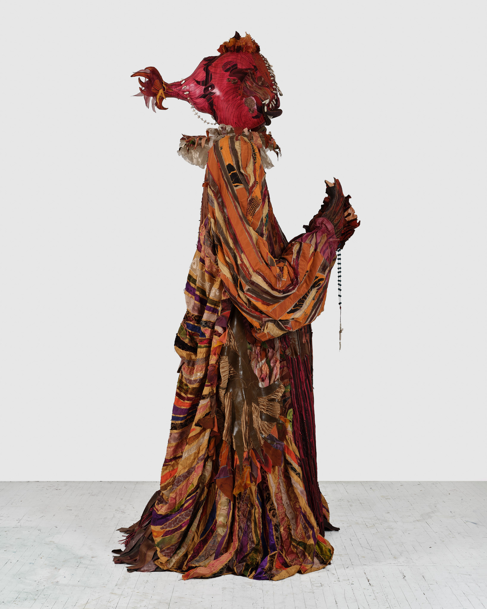 The Reaper, 2024, Steel; enamel paint; acrylic paint and finisher; repurposed leather, suede, snakeskin, goatskin and assorted fabric; leather, fabric, and natural dyes; seashells; conch; coral bone; stones; assorted found objects; wire; jute; gold and silk thread; coated nylon thread; and coated cotton thread, 139 1/2H x 64 x 64 inches