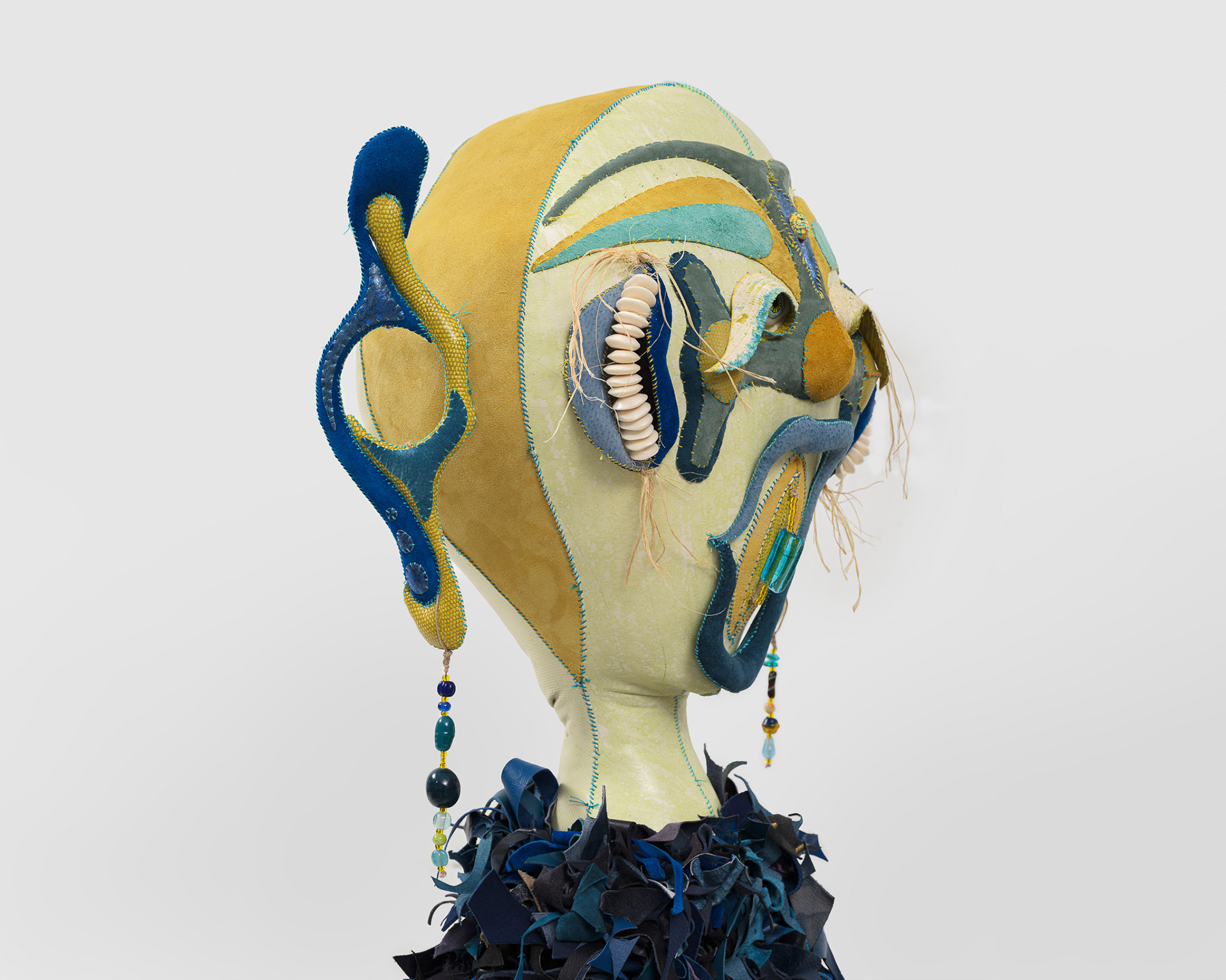 (detail) The Siren of Amazonis Planitia, 2023, Steel, wood, enamel paint, acrylic paint, leather dye and finisher, repurposed leather and suede, stones, ox bone beads and assorted found beads, twine, and coated nylon thread, 65 1/2H x 16 x 16 inches