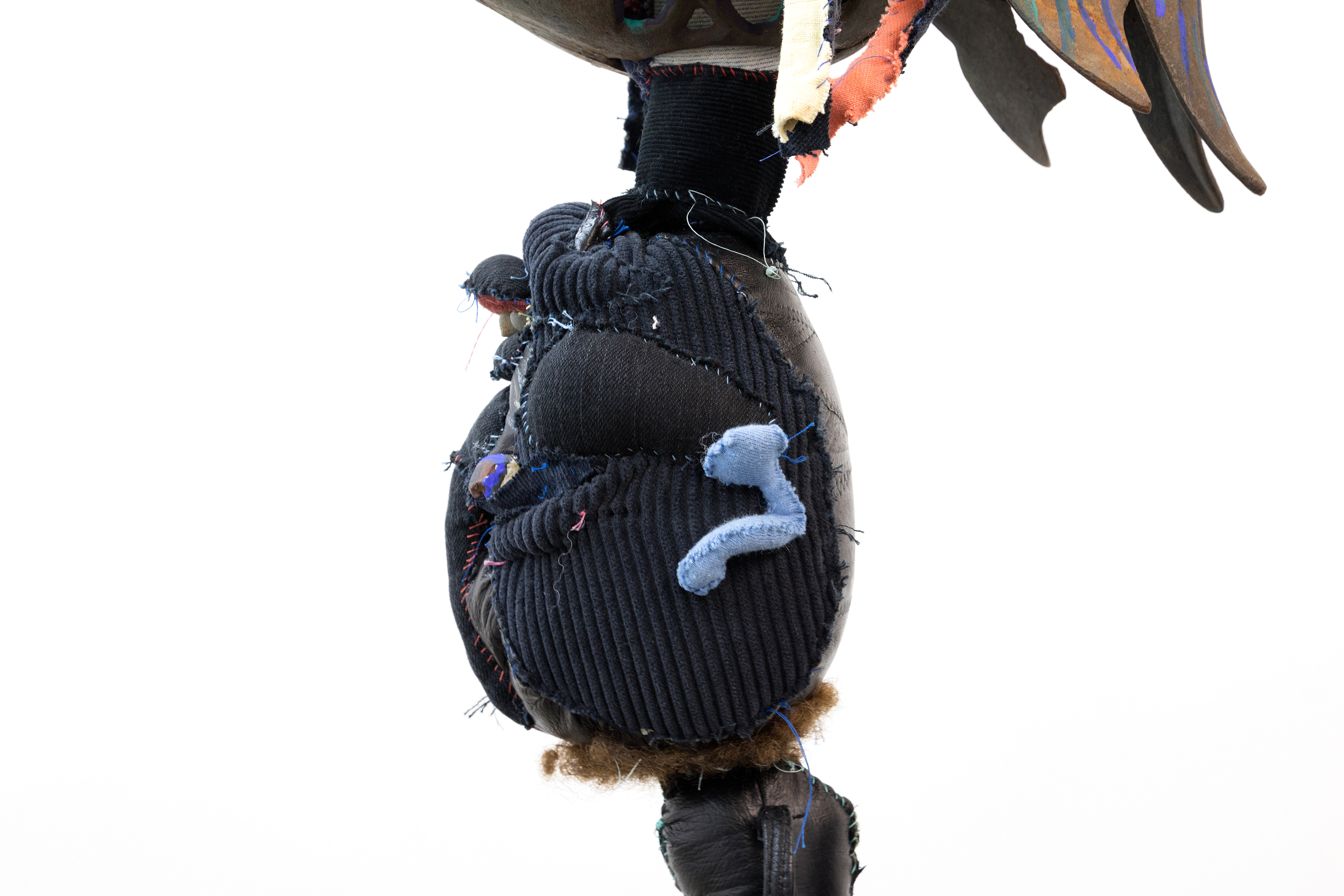 the first breath we took together as one negro fish, 2018. Fabric, leather, lantern, seashells, acrylic paint, stones, human hair, jute. Dimensions variable.