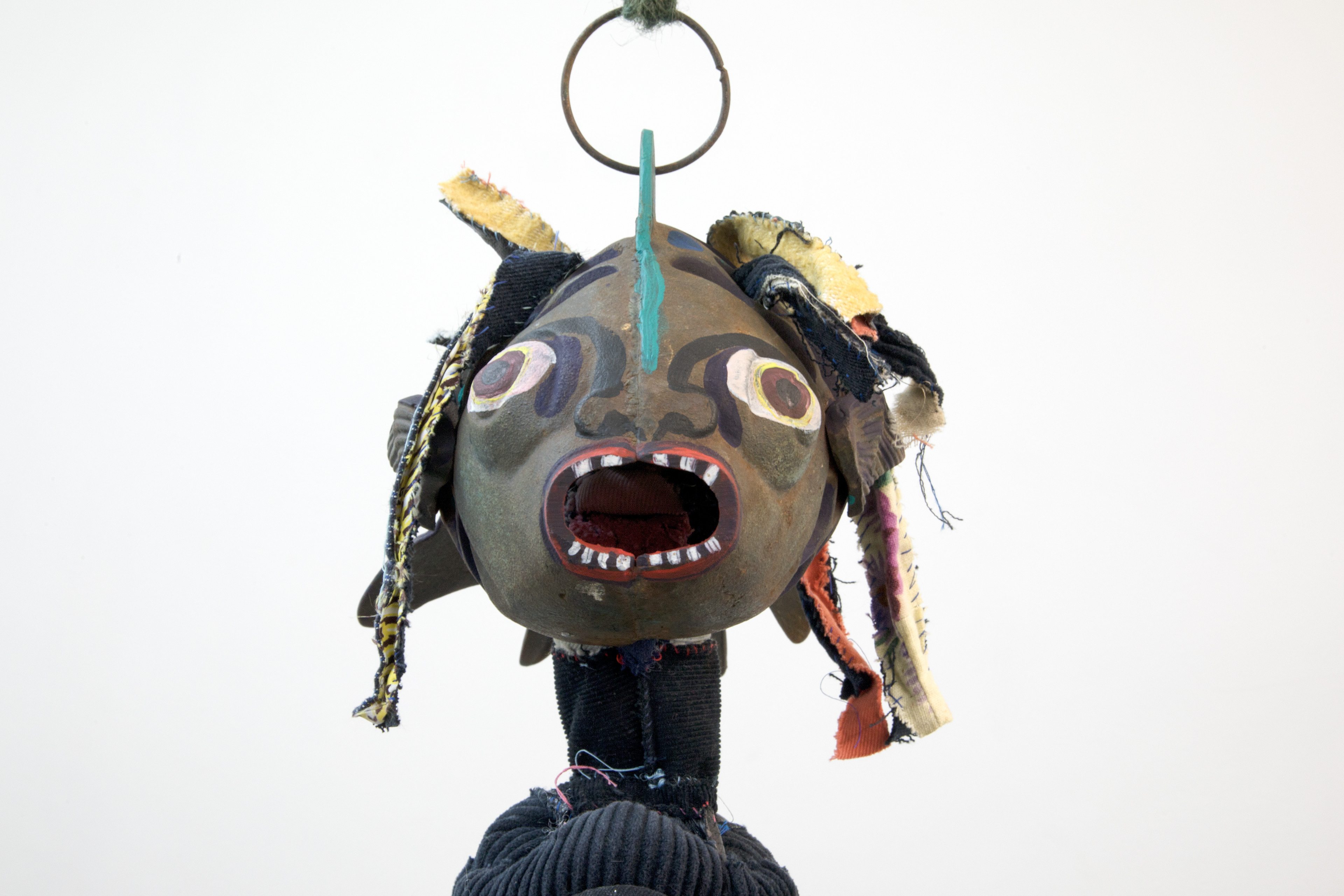 the first breath we took together as one negro fish, 2018. Fabric, leather, lantern, seashells, acrylic paint, stones, human hair, jute. Dimensions variable.