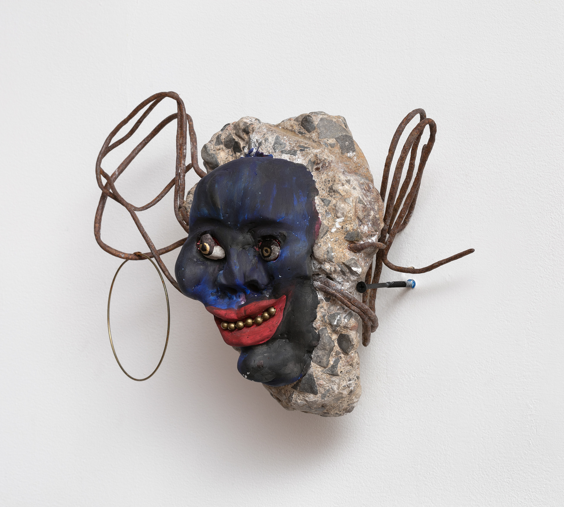 Shine eye grinner, 2018. Concrete, rebar, plaster, stones, metal beads, acrylic paint, dried flowers. 10 x 12 x 7 in (25.4 x 30.5 x 17.8 cm).