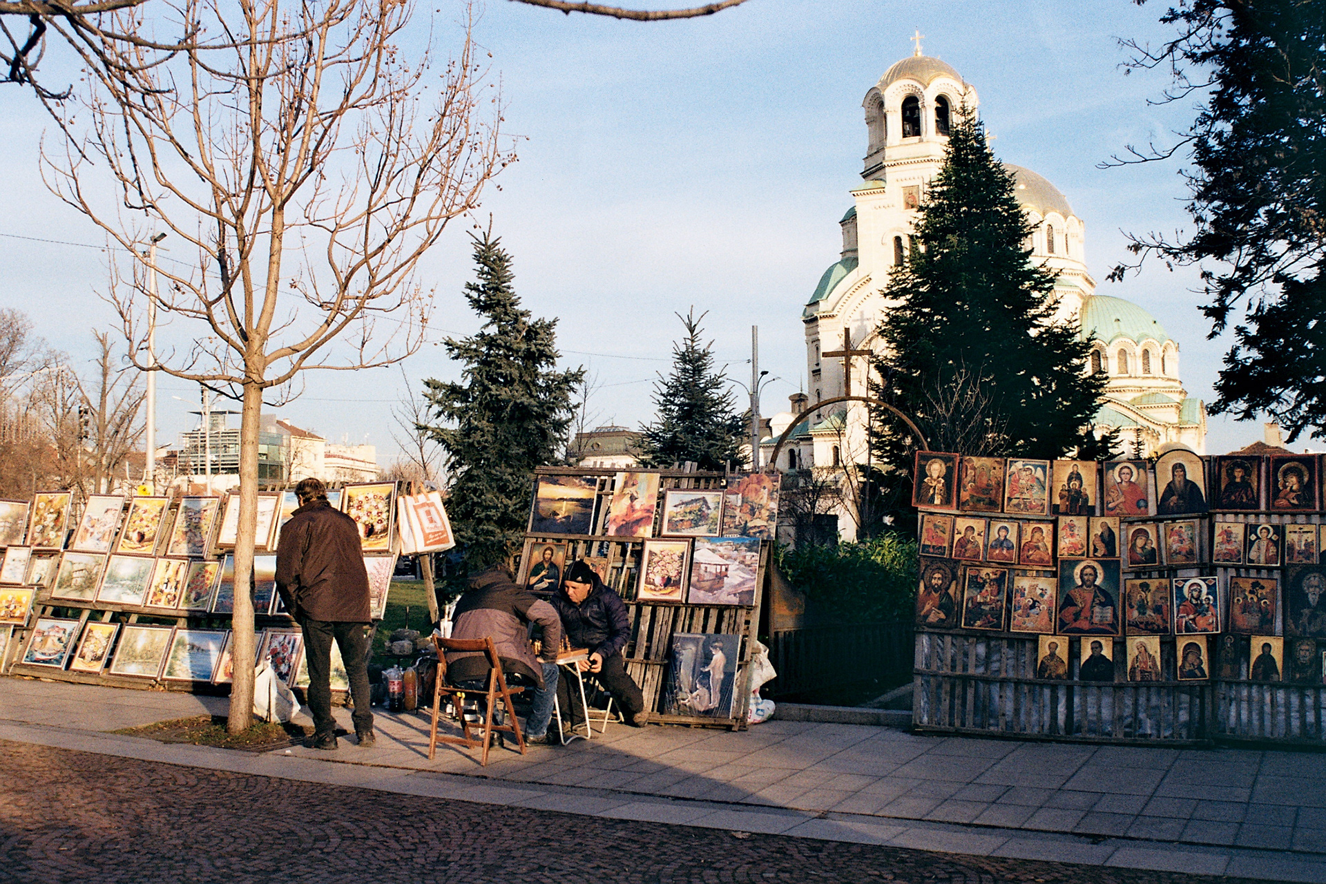 Men playing chess while selling their art outside Alexander Nevsky
